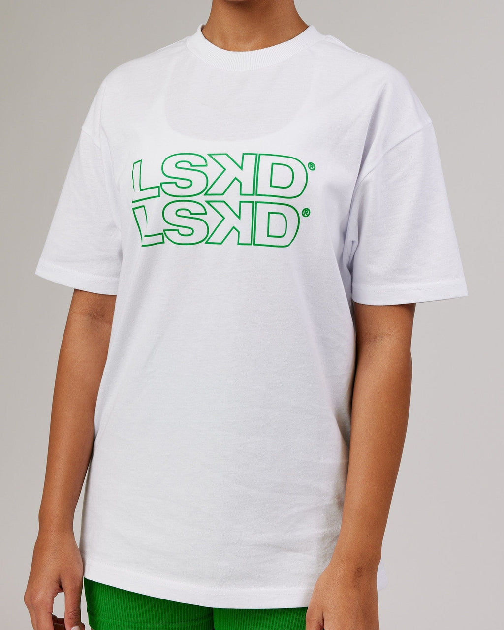 Model wearing Unisex Stacks Up Heavyweight Oversize Tee - White-Vivid Green