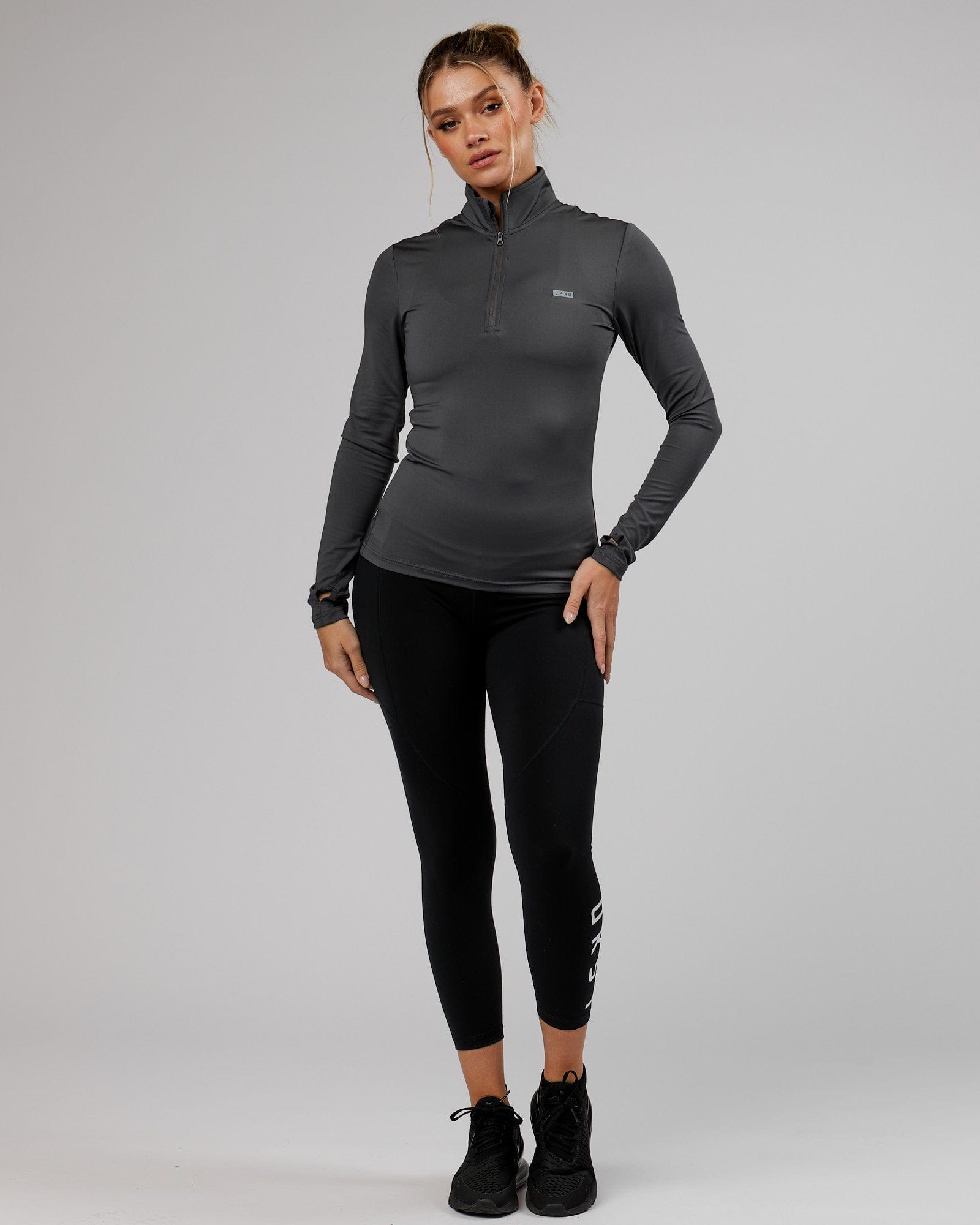 Model wearing Streamlined 1/4 Zip Active LS Top  - Asphalt