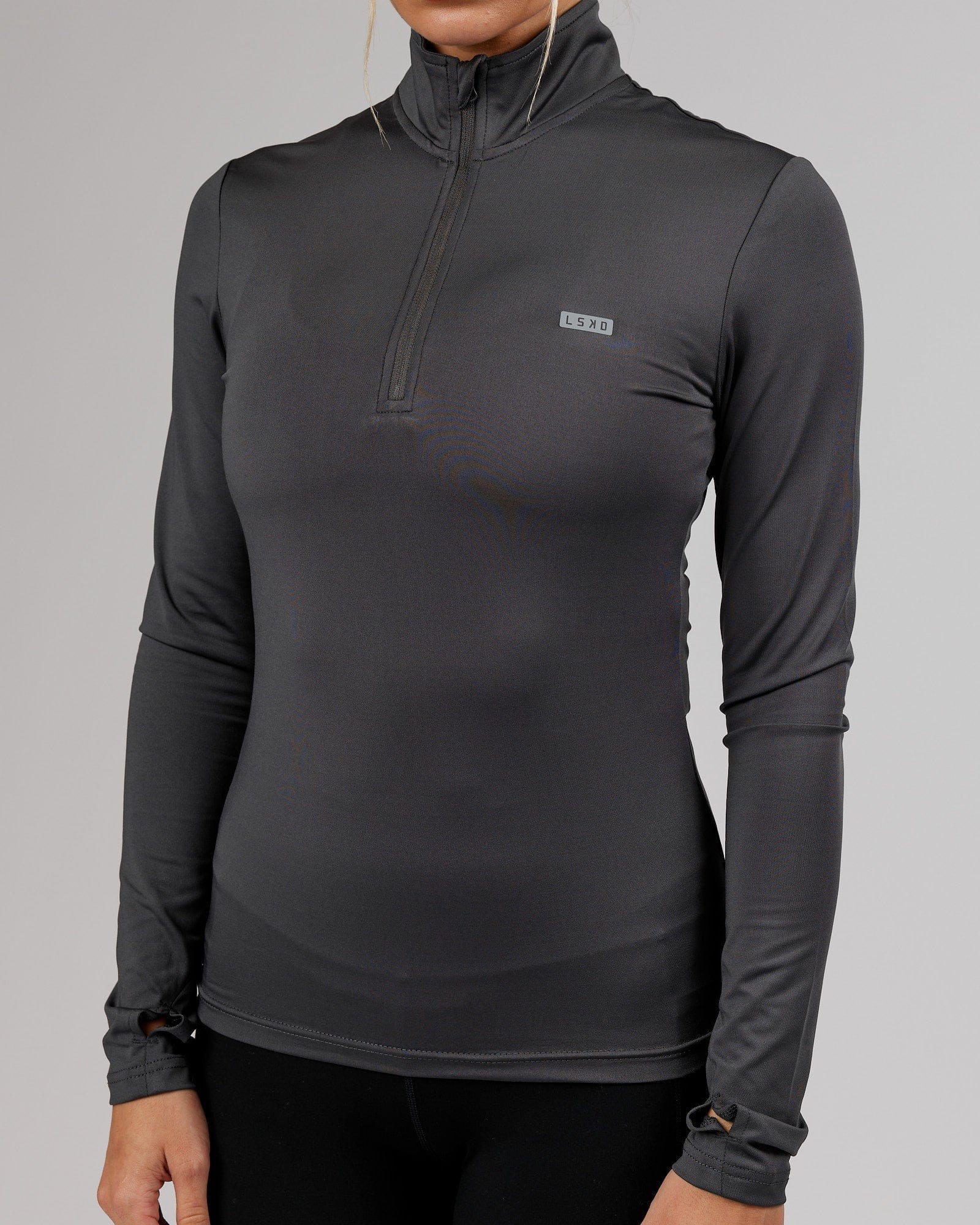 Model wearing Streamlined 1/4 Zip Active LS Top  - Asphalt