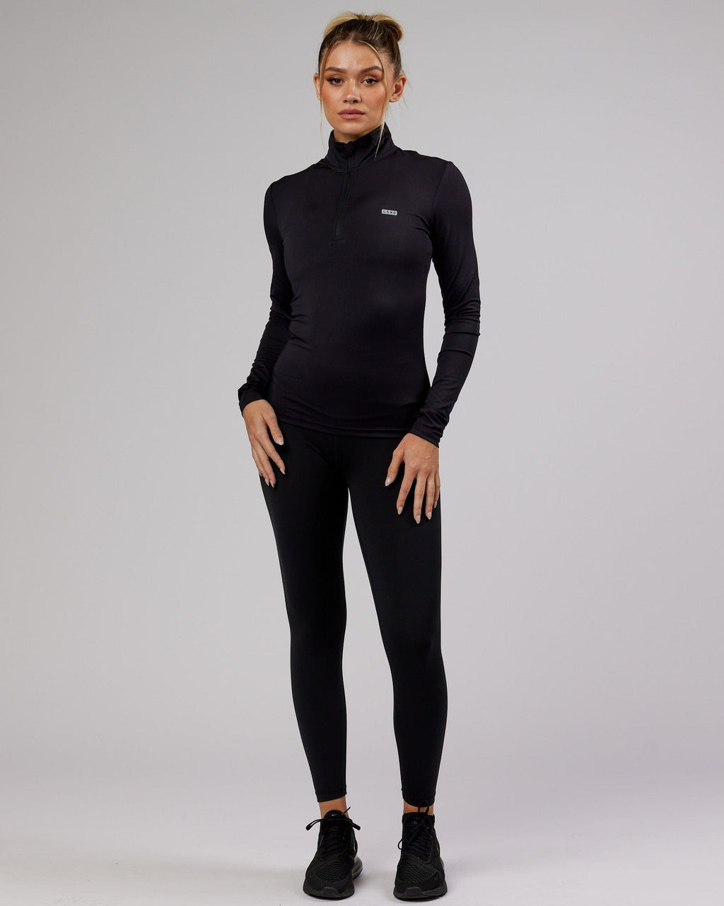 Model wearing Streamlined 1/4 Zip Active LS Top - Black