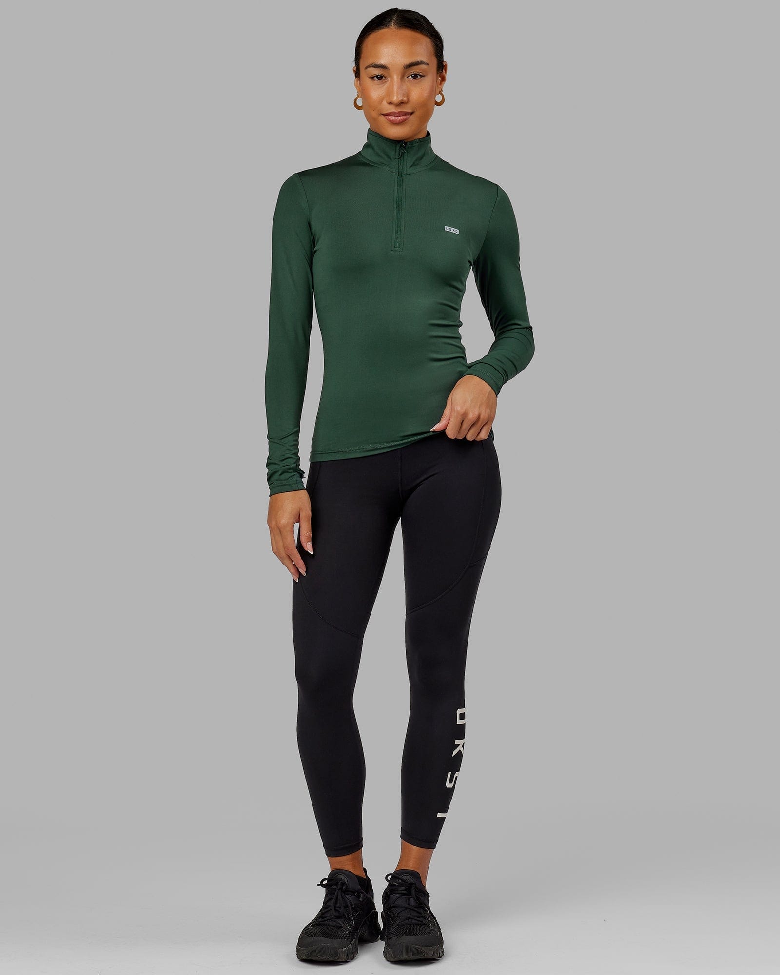 Model wearing Streamlined 1/4 Zip LS Top - Vital Green