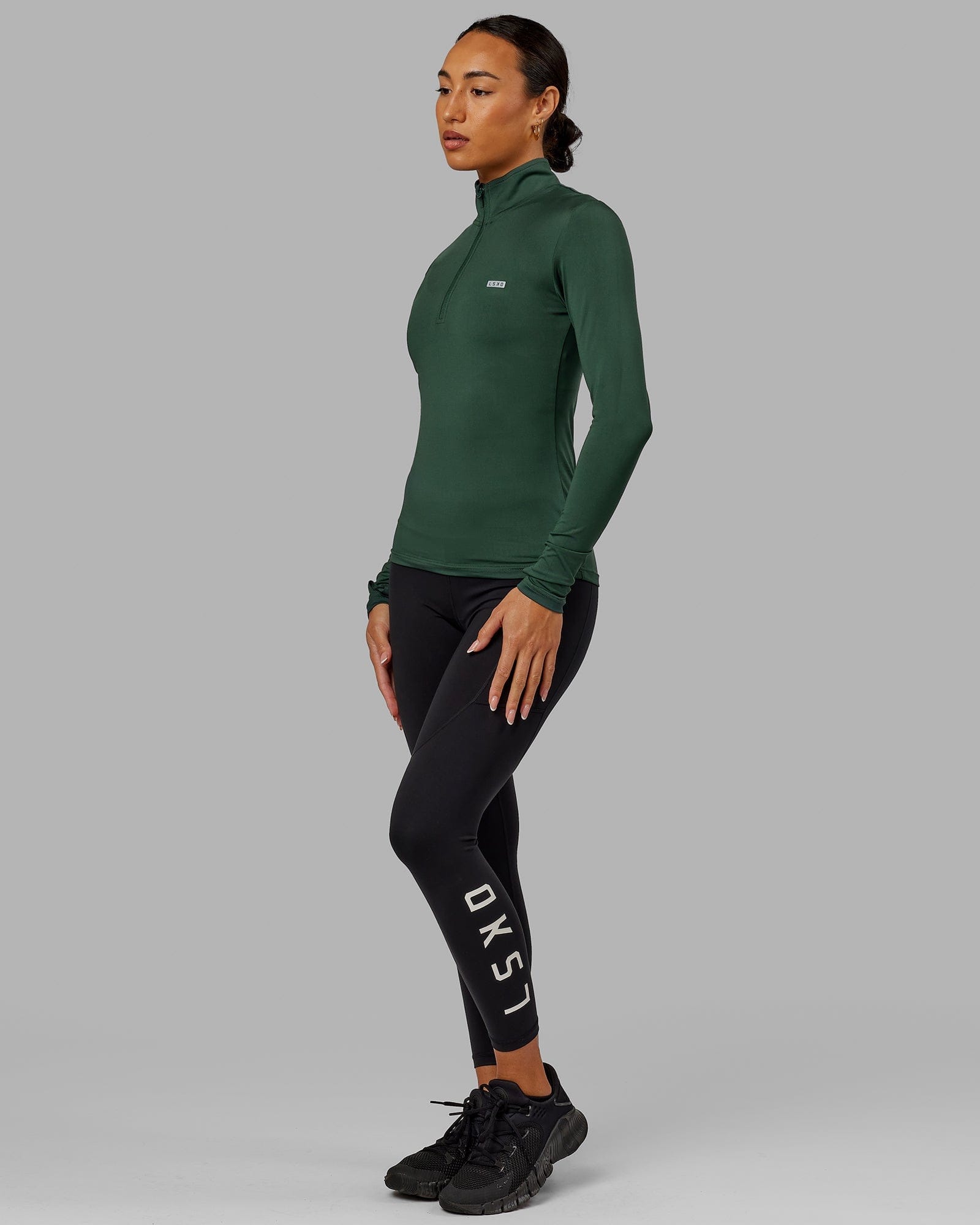 Model wearing Streamlined 1/4 Zip LS Top - Vital Green
