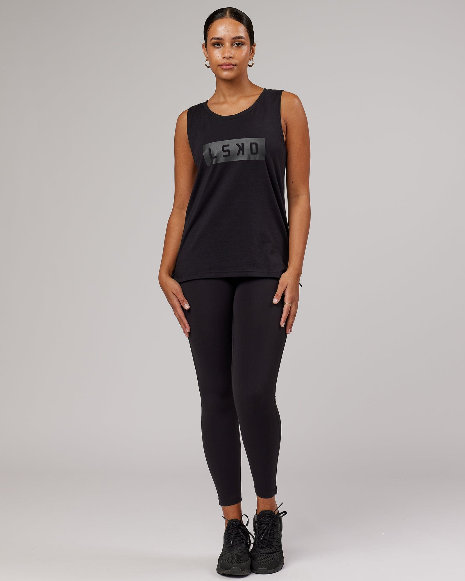 Model wearing Strength FLXDRY Performance Tank - Black-Black