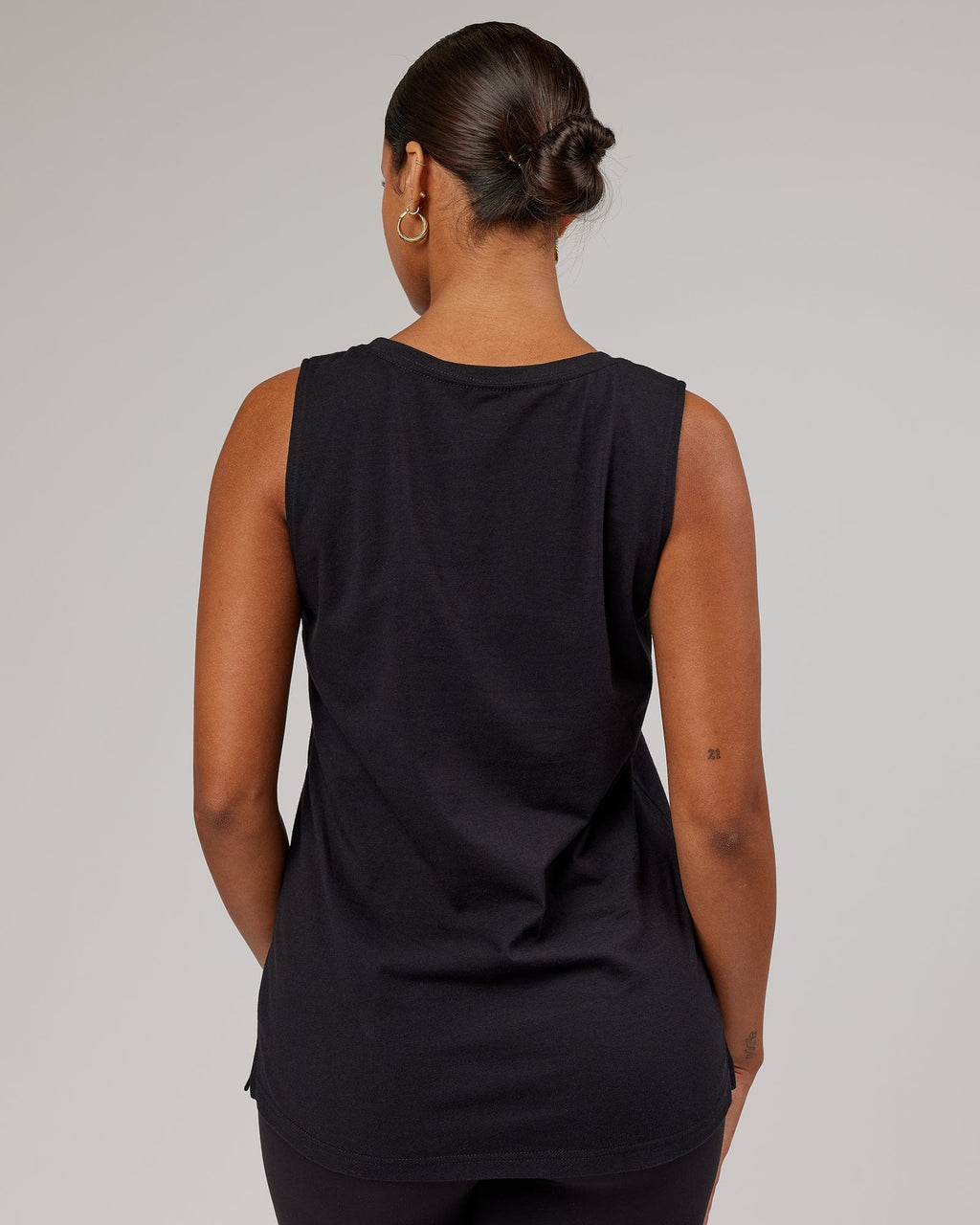 Model wearing Strength FLXDRY Performance Tank - Black-Black