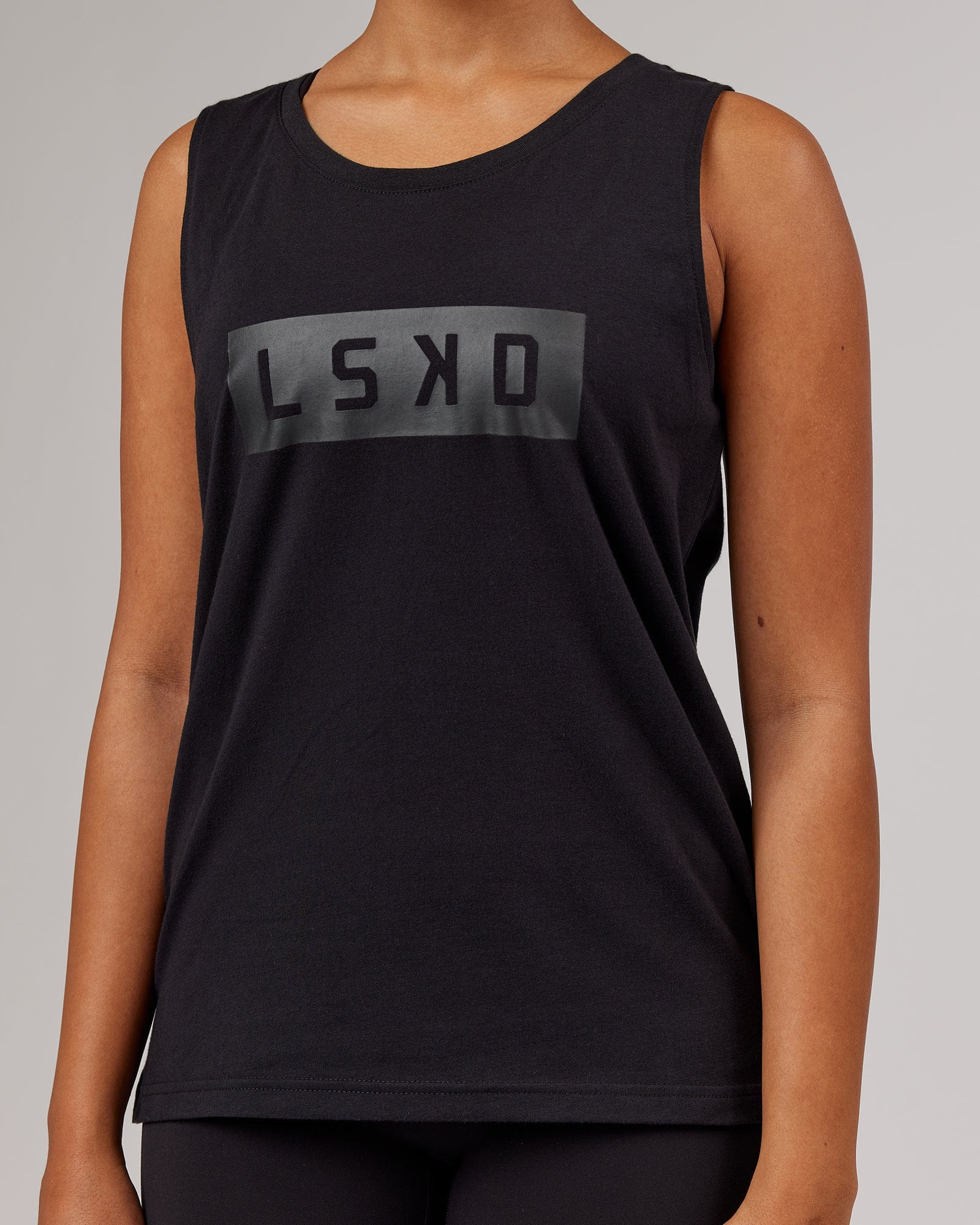 Model wearing Strength FLXDRY Performance Tank - Black-Black