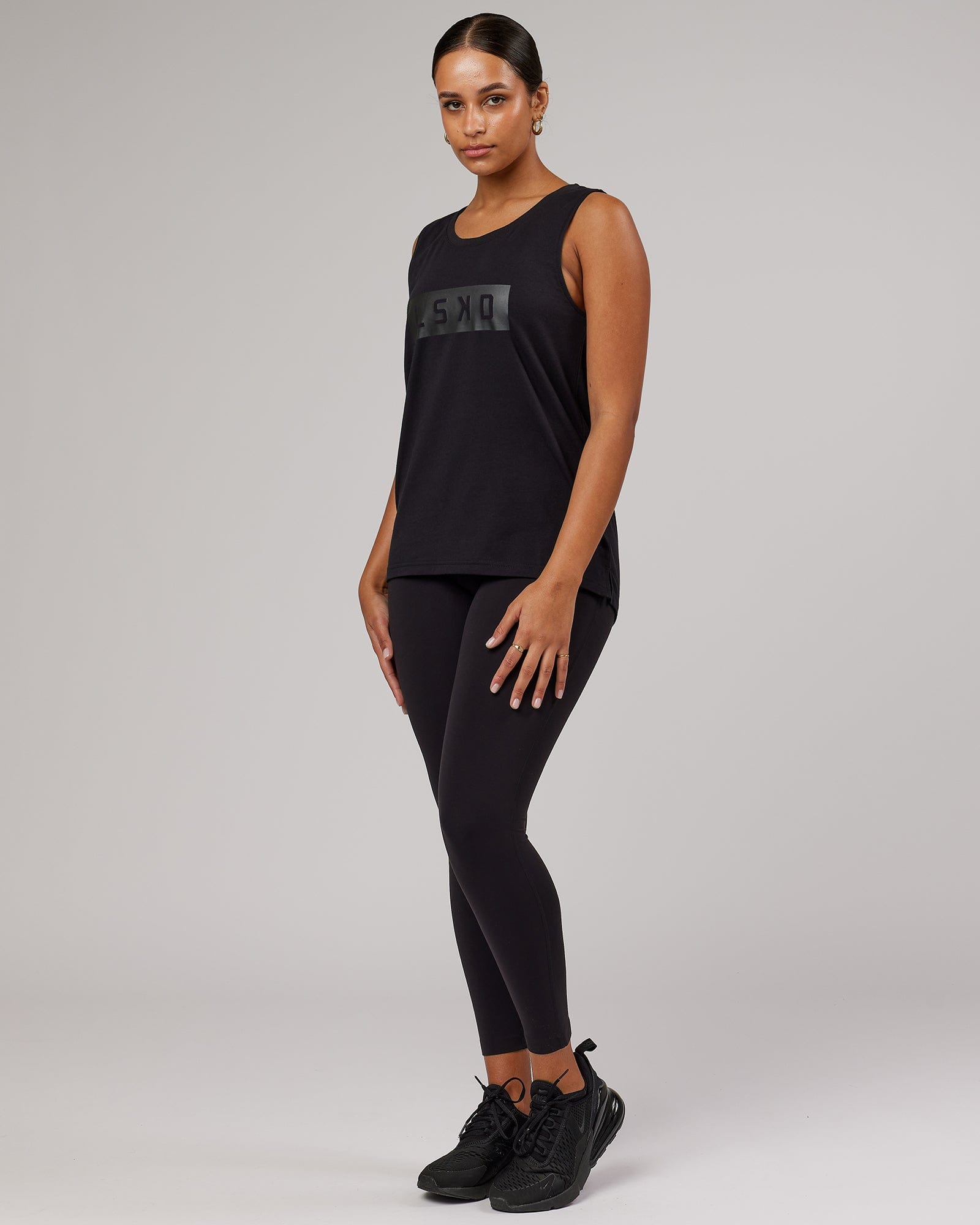 Model wearing Strength FLXDRY Performance Tank - Black-Black