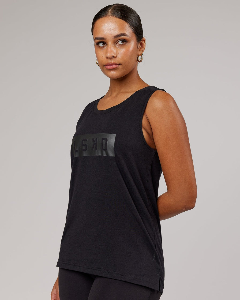 Model wearing Strength FLXDRY Performance Tank - Black-Black