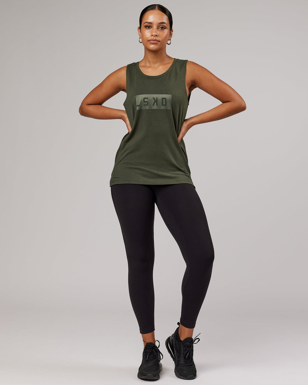 Model wearing Strength FLXDRY Performance Tank - Forest Night