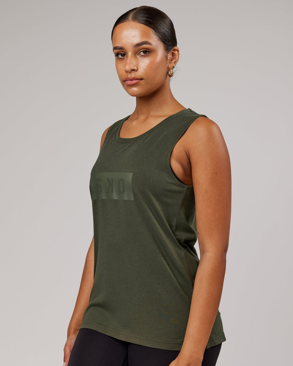 Model wearing Strength FLXDRY Performance Tank - Forest Night