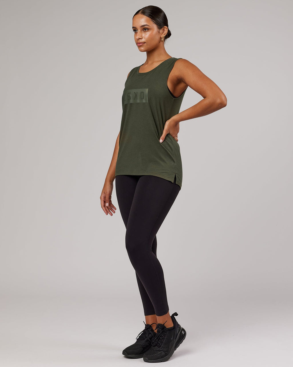 Model wearing Strength FLXDRY Performance Tank - Forest Night