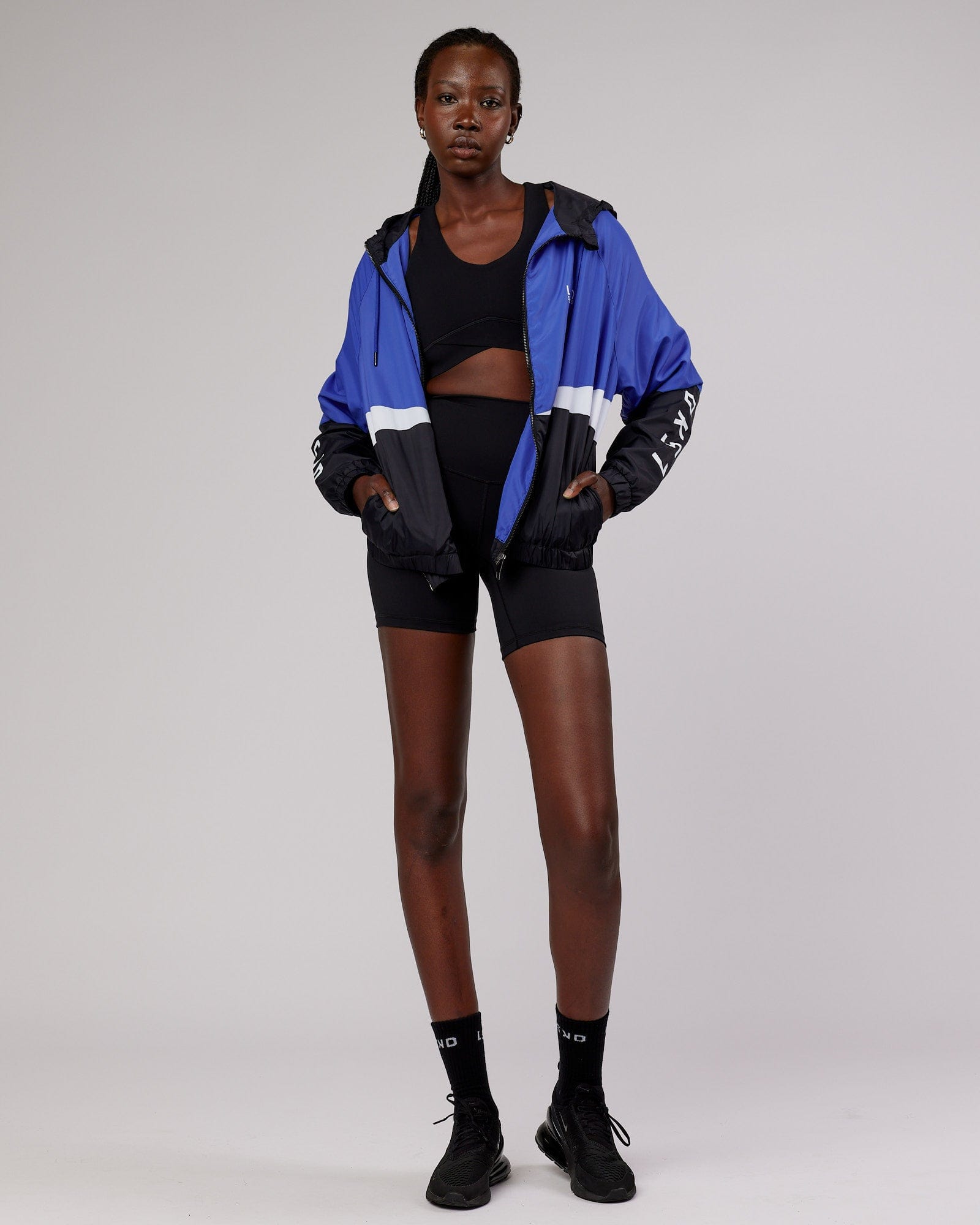 Model wearing Trackside Jacket - Power Cobalt