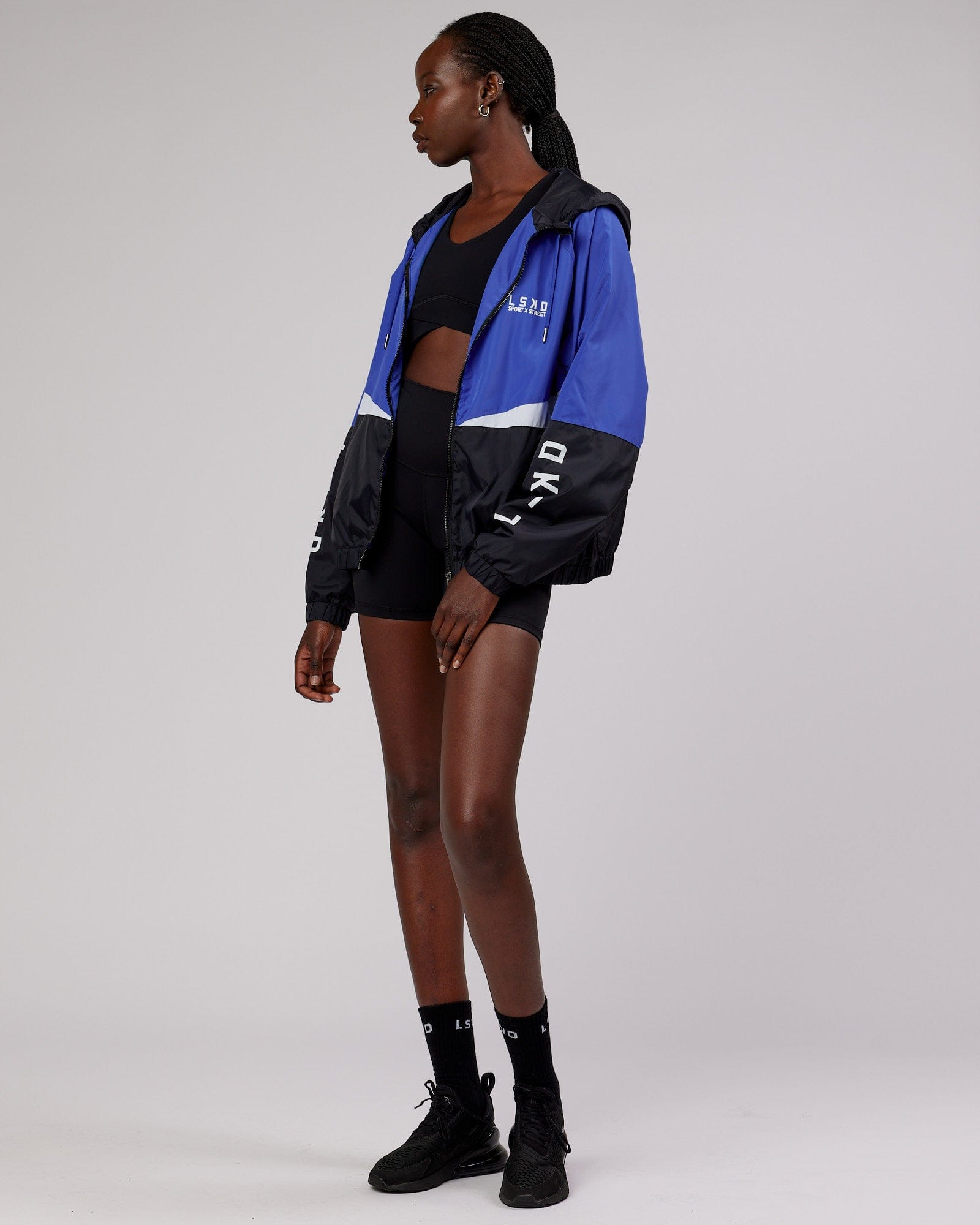 Model wearing Trackside Jacket - Power Cobalt