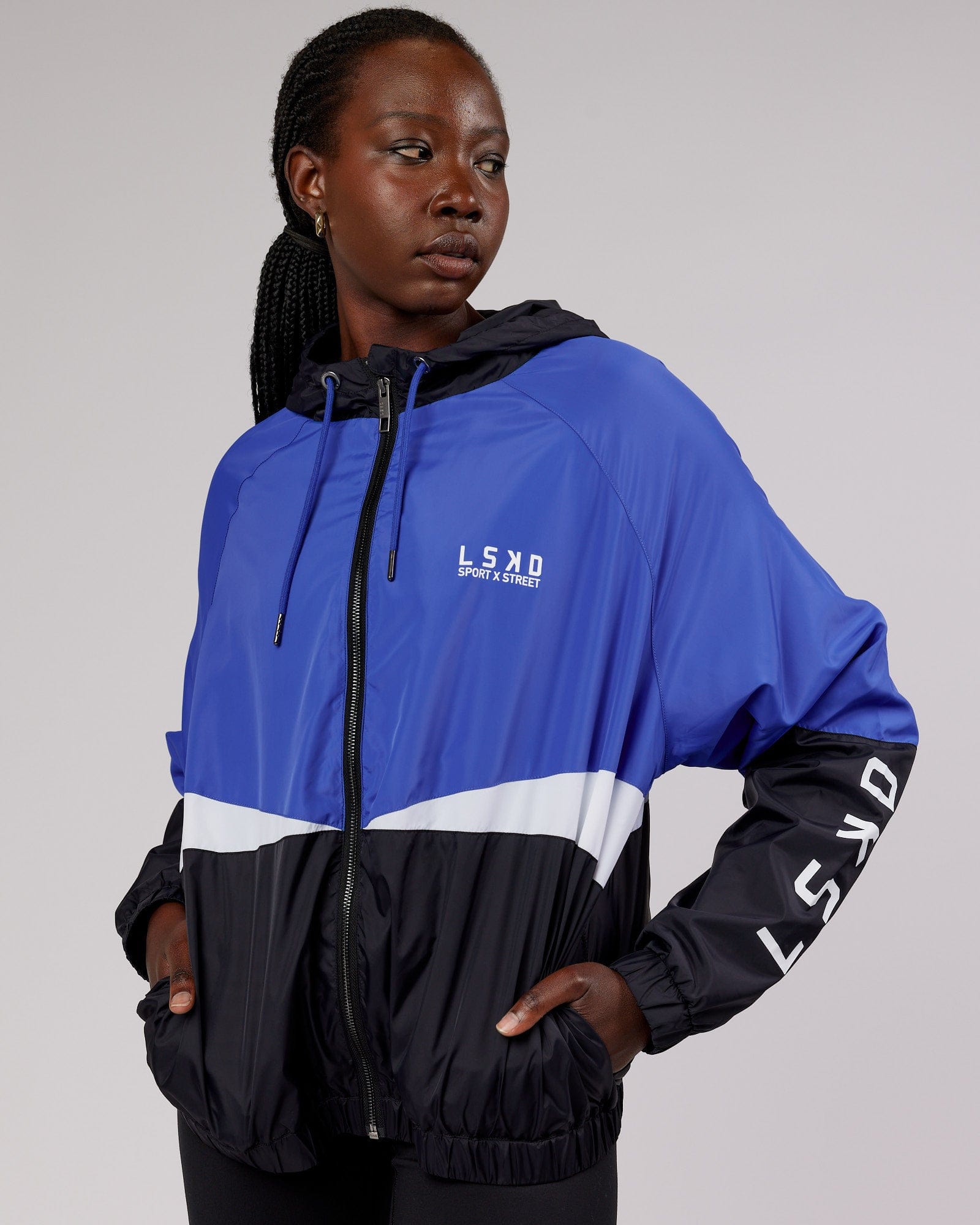 Model wearing Trackside Jacket - Power Cobalt