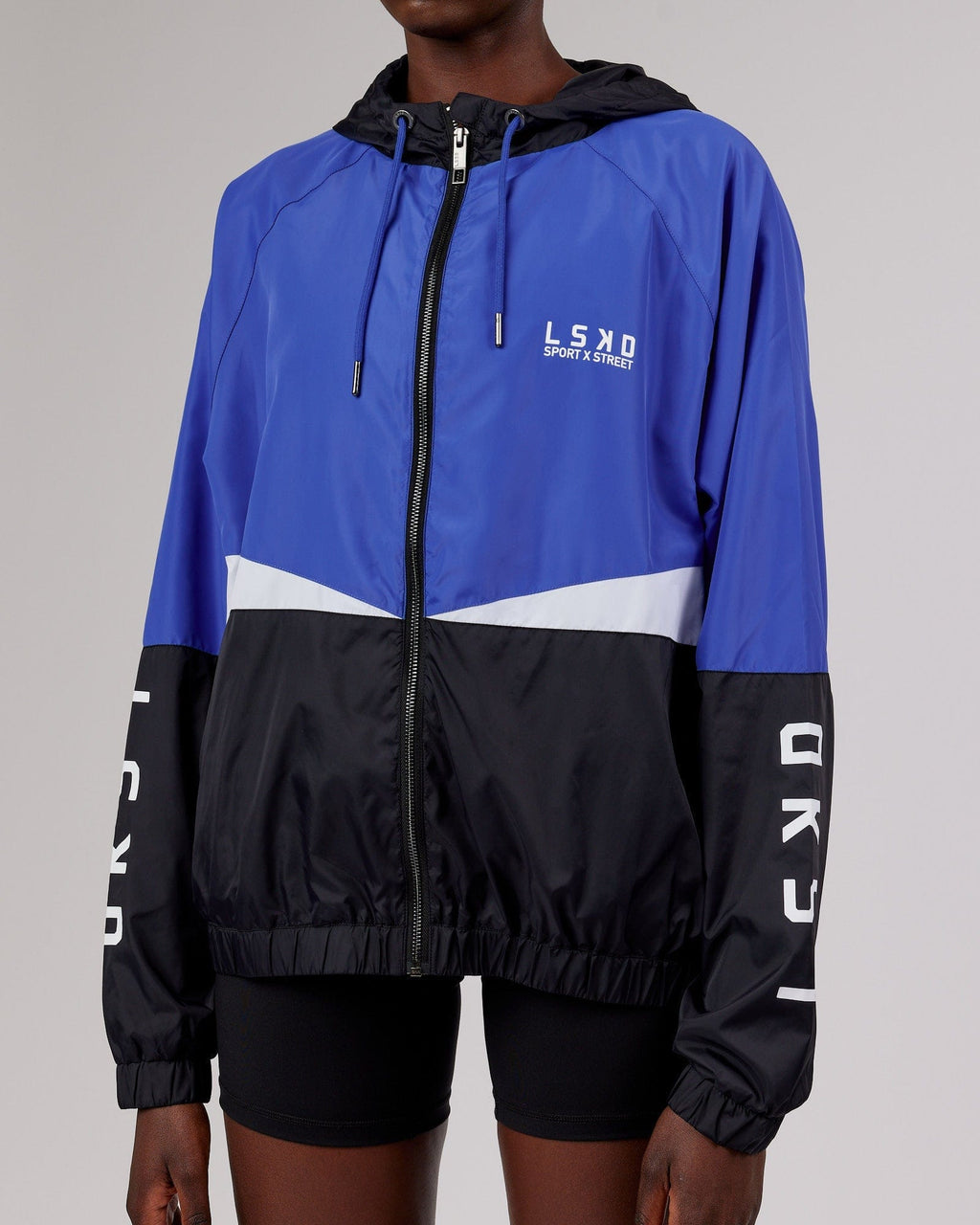 Model wearing Trackside Jacket - Power Cobalt