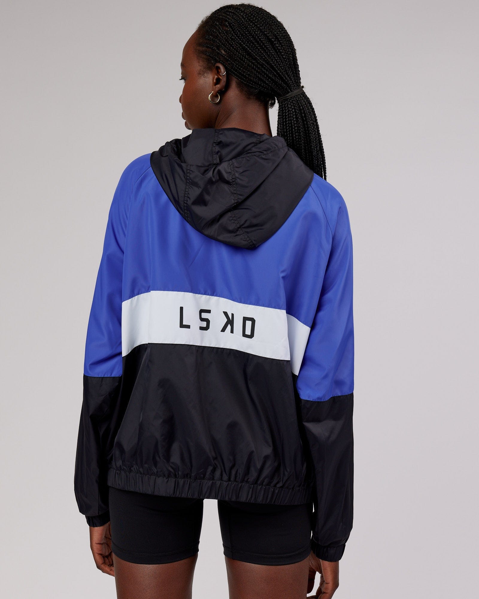 Model wearing Trackside Jacket - Power Cobalt