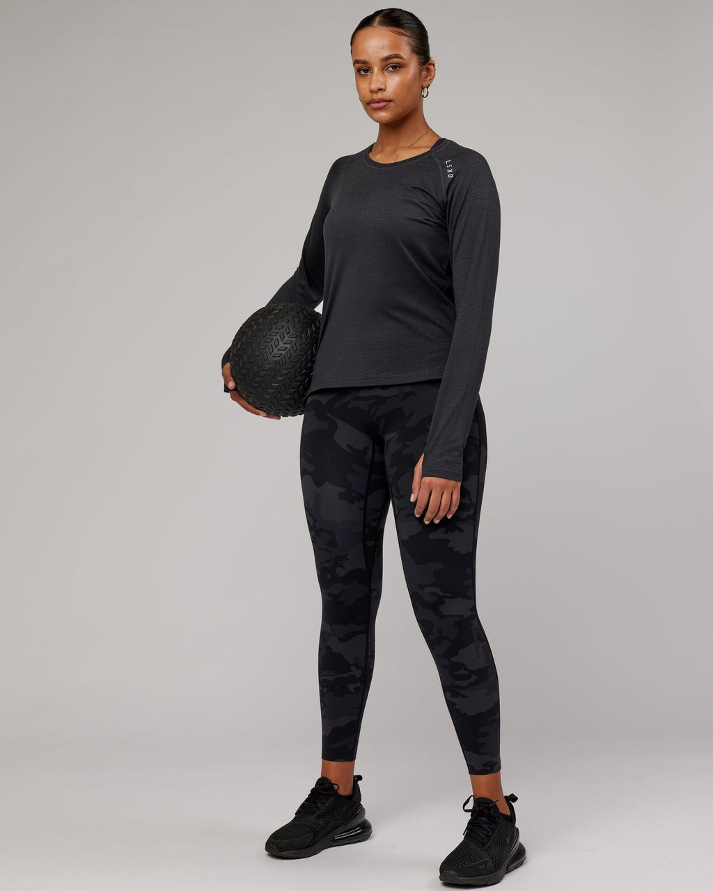 Model wearing Perform VapourFLX LS Tee - Black Marl