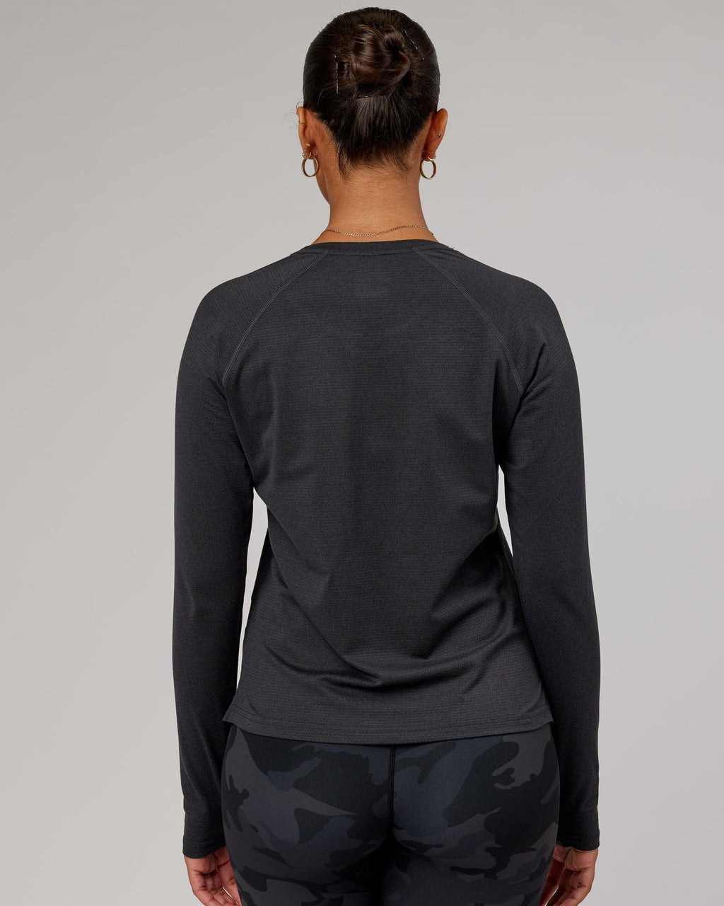Model wearing Perform VapourFLX LS Tee - Black Marl