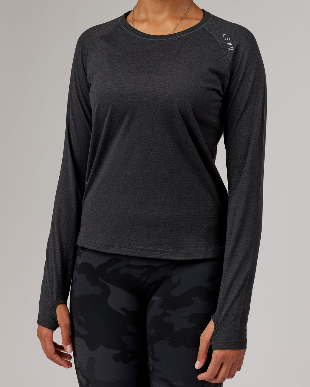 Model wearing Perform VapourFLX LS Tee - Black Marl