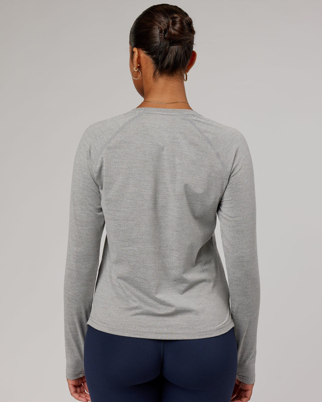 Model wearing Perform VapourFLX LS Tee - Lt Grey Marl