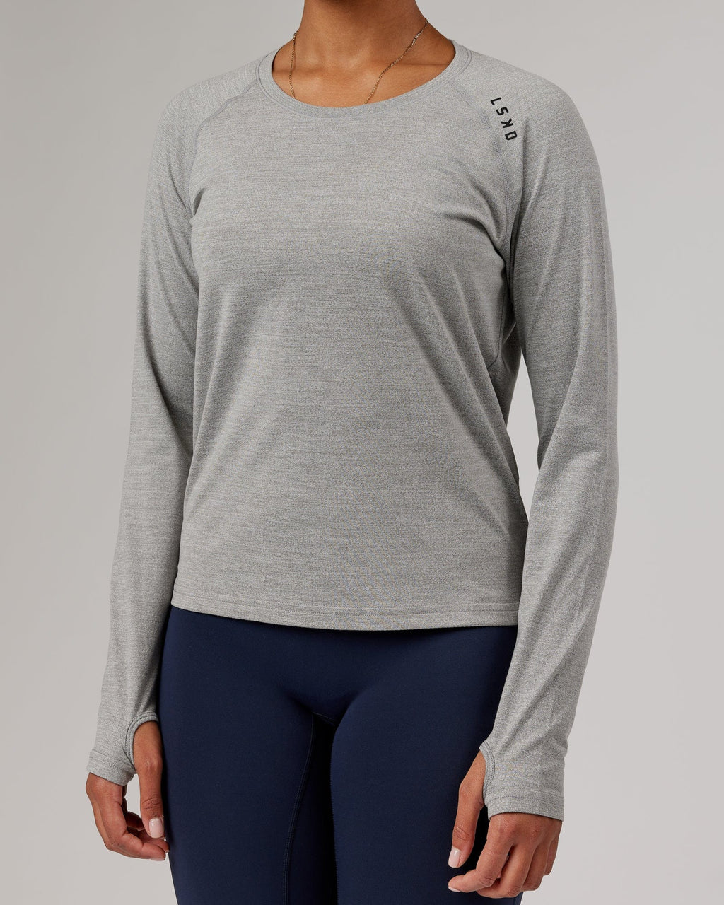 Model wearing Perform VapourFLX LS Tee - Lt Grey Marl