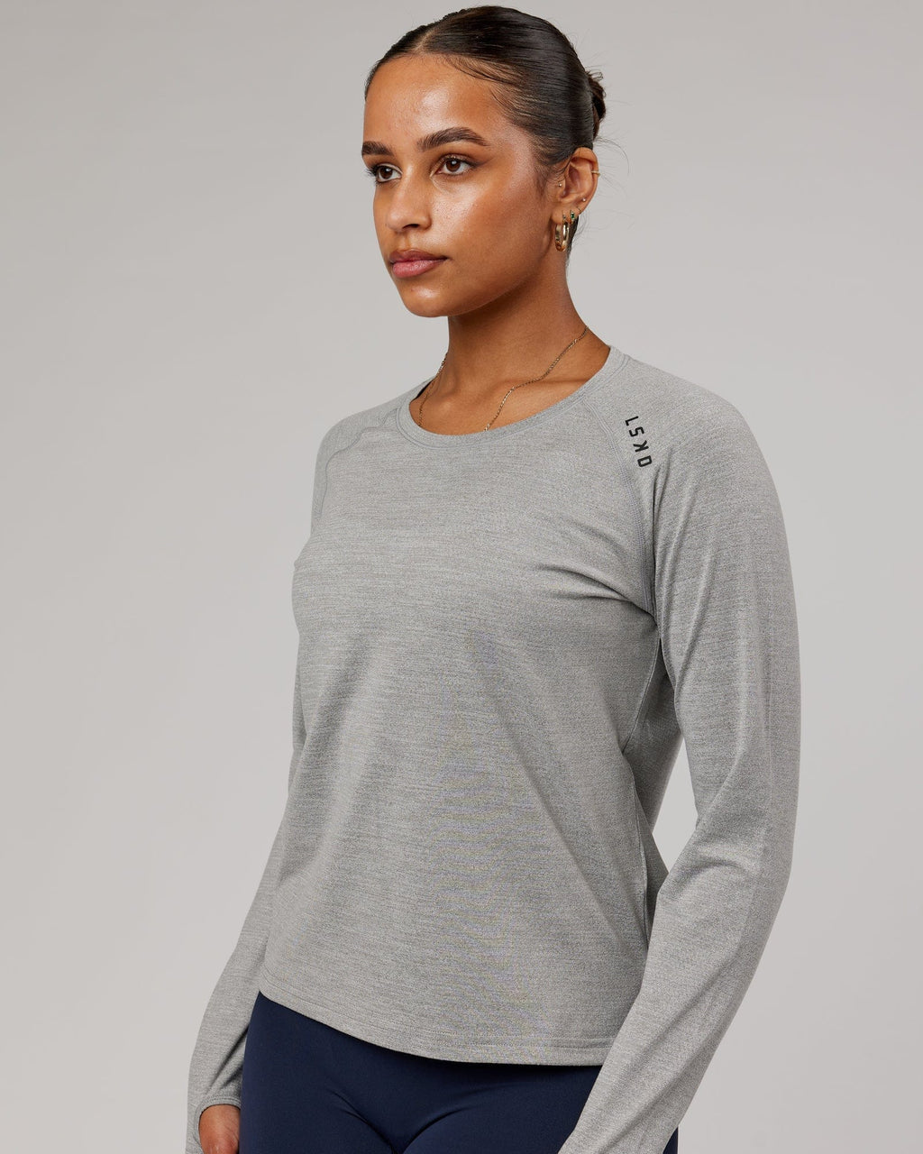 Model wearing Perform VapourFLX LS Tee - Lt Grey Marl