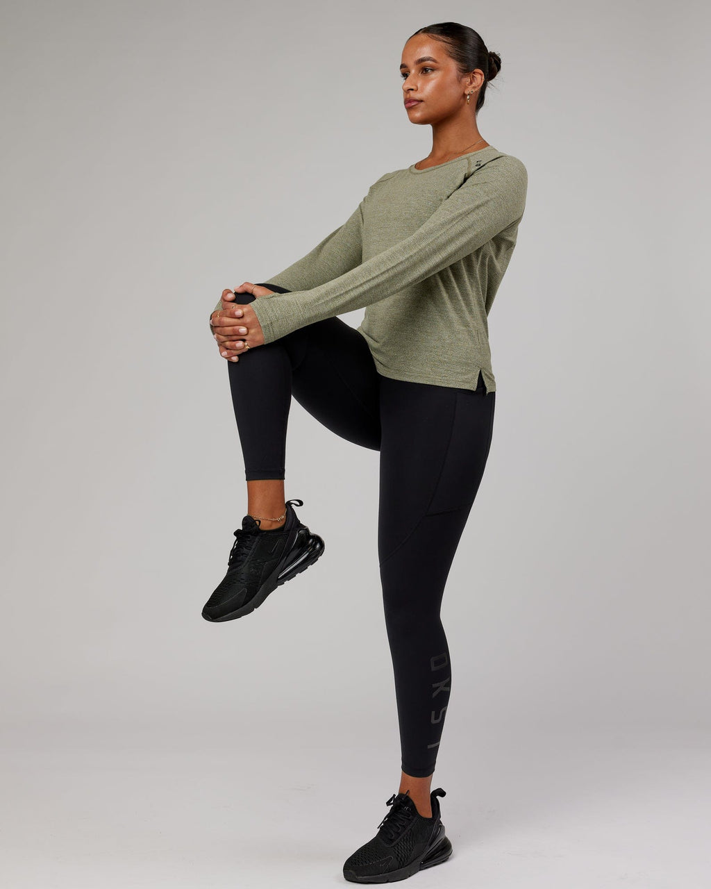 Model wearing Perform VapourFLX LS Tee - Olive Marl