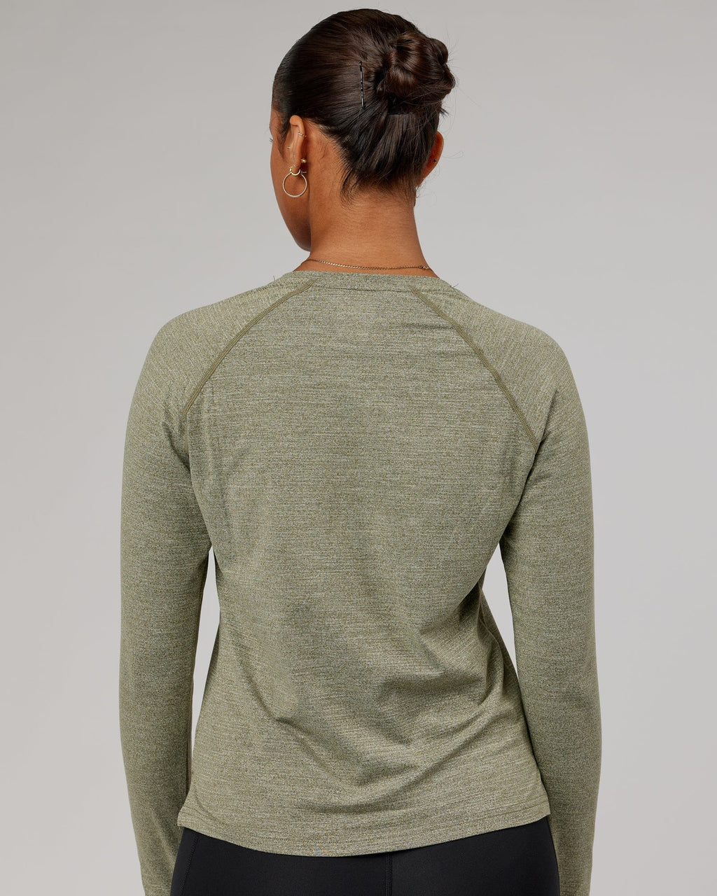 Model wearing Perform VapourFLX LS Tee - Olive Marl