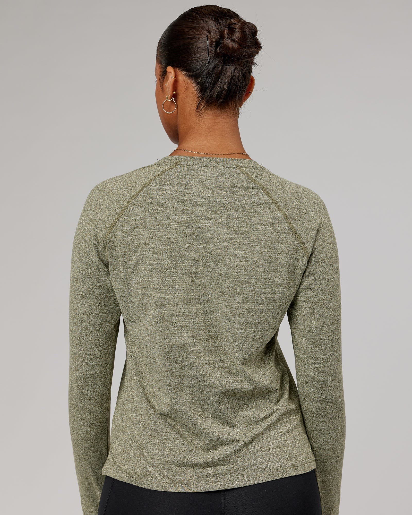 Model wearing Perform VapourFLX LS Tee - Olive Marl