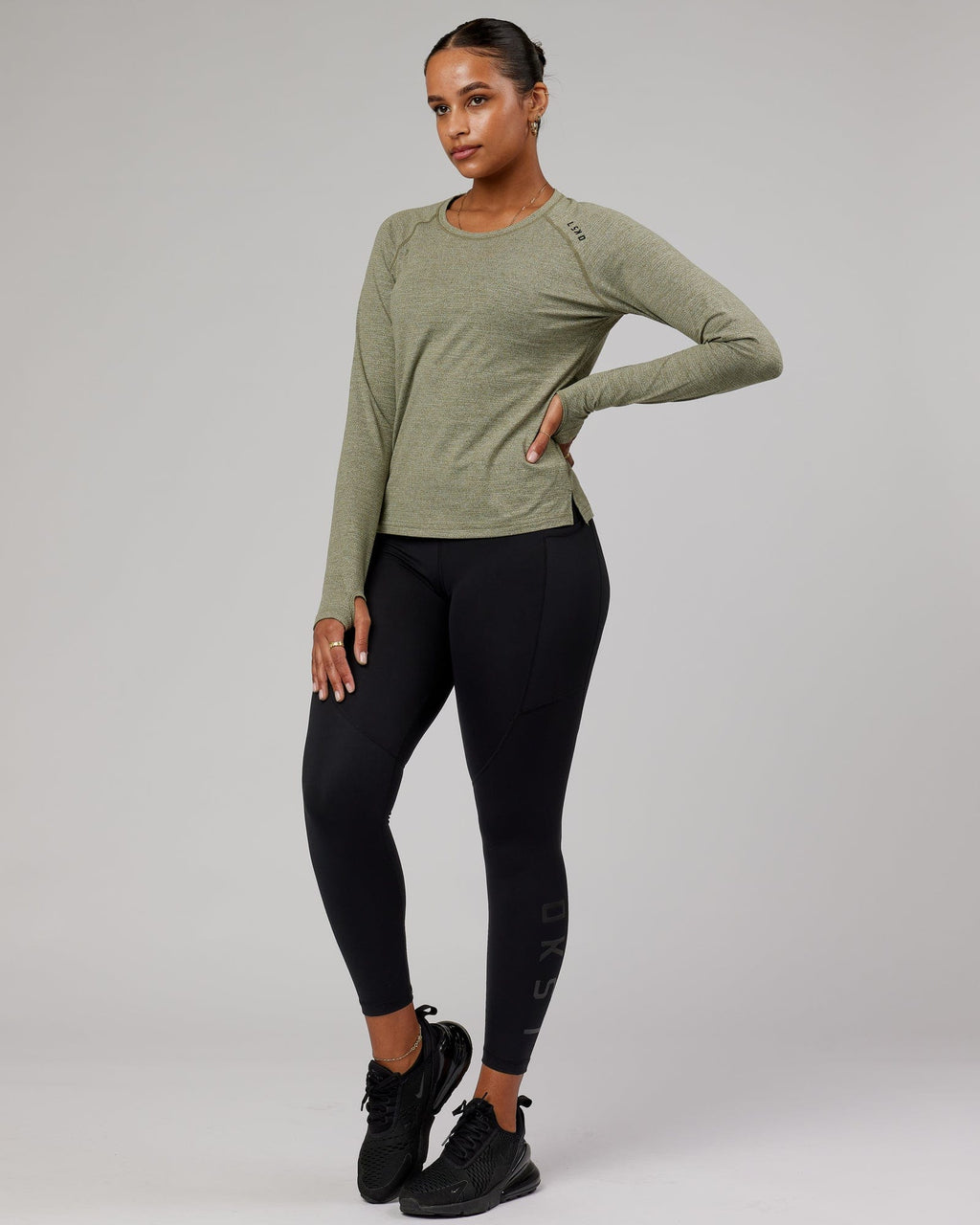 Model wearing Perform VapourFLX LS Tee - Olive Marl