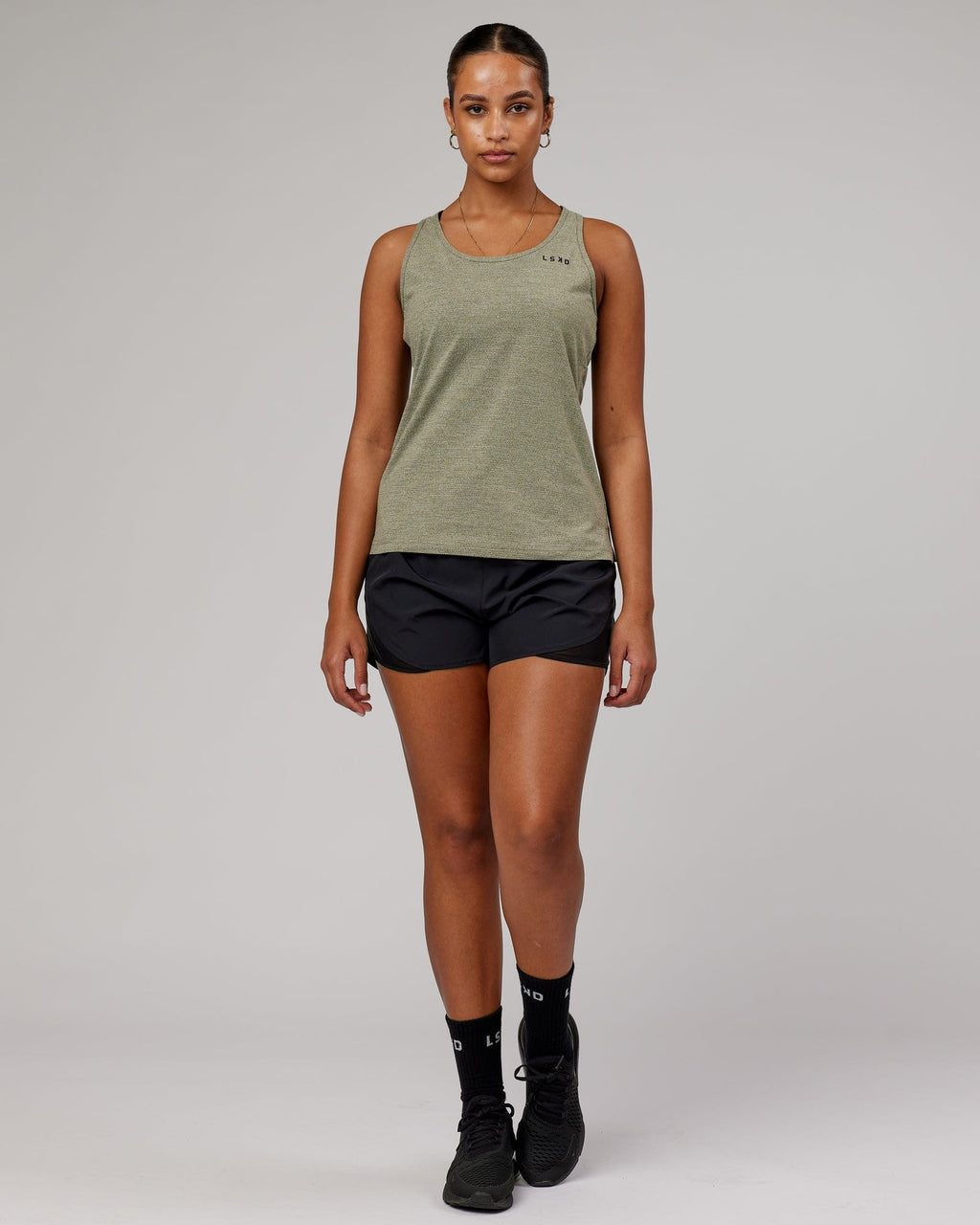 Model wearing Perform VapourFLX Tank - Olive Marl