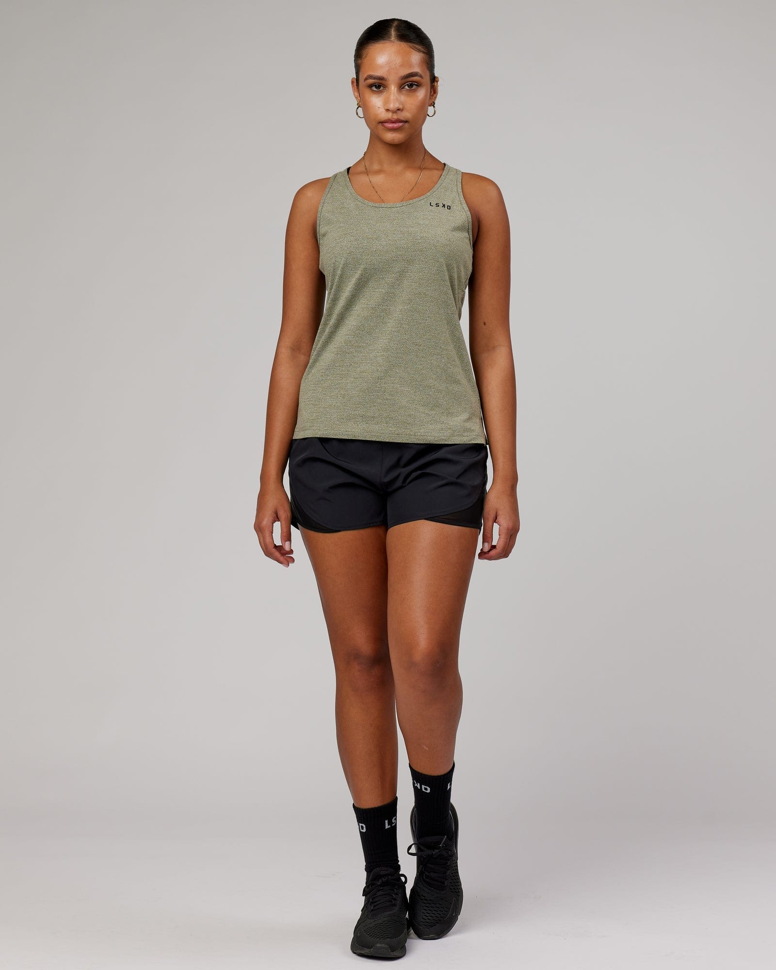 Model wearing Perform VapourFLX Tank - Olive Marl