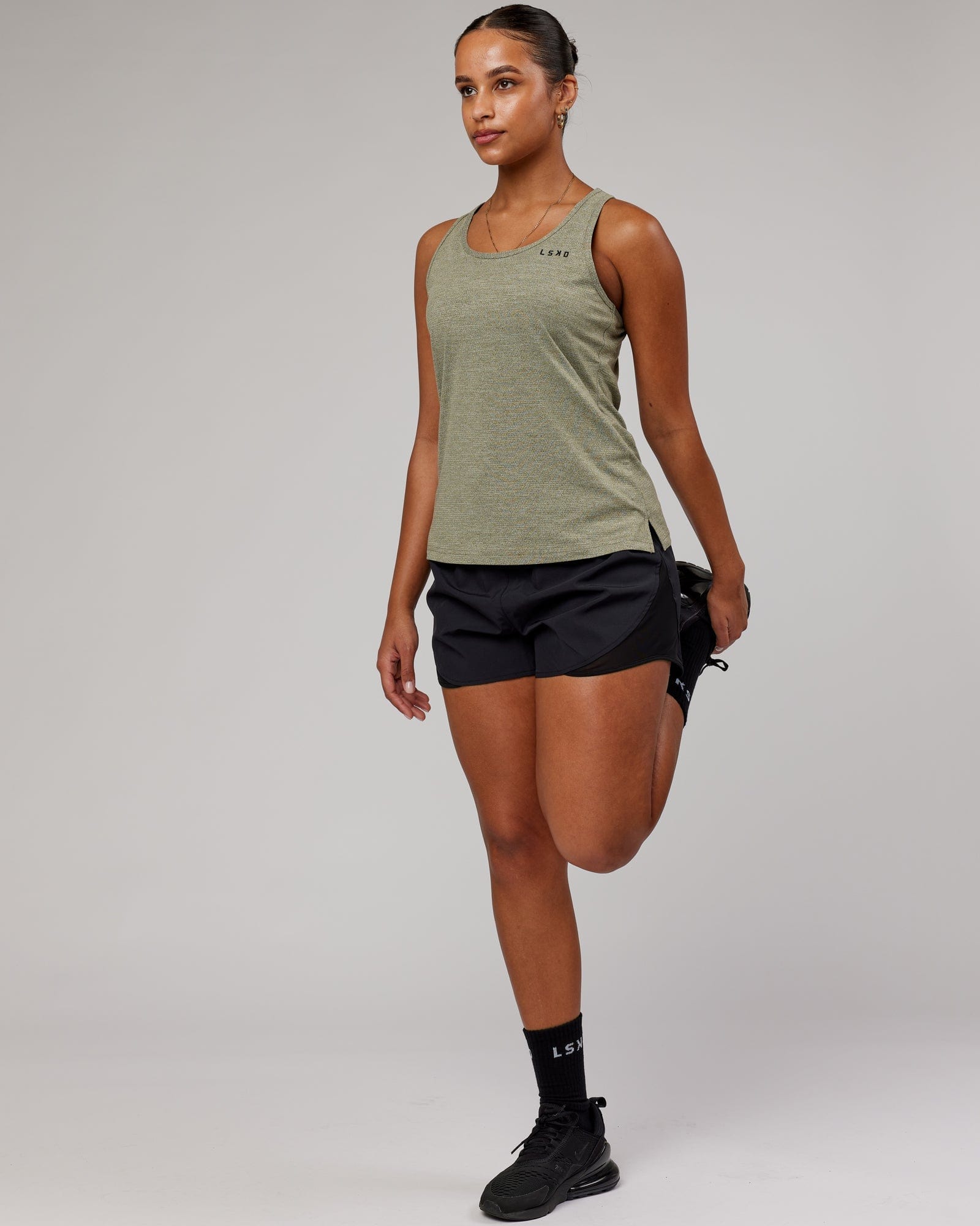 Model wearing Perform VapourFLX Tank - Olive Marl