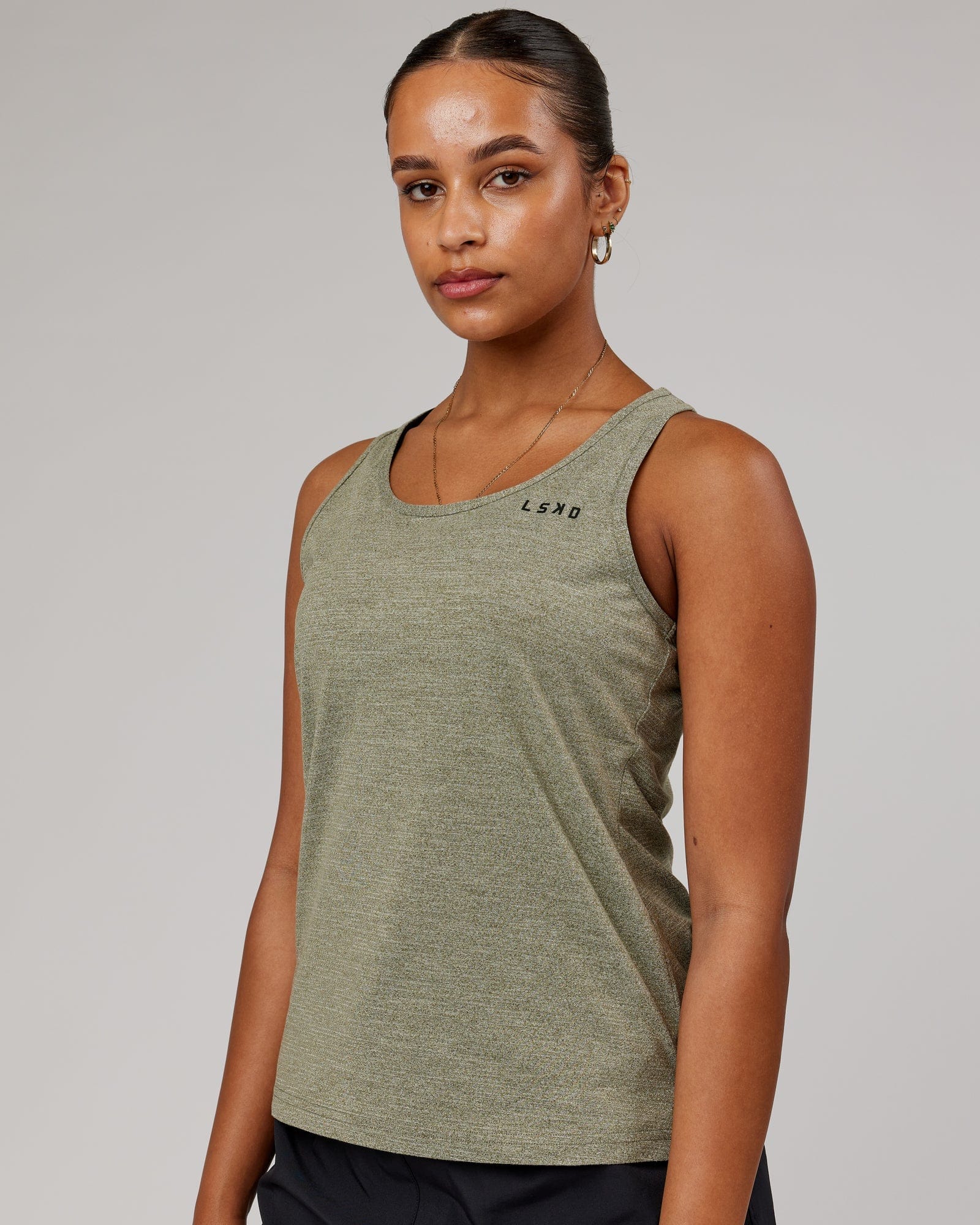 Model wearing Perform VapourFLX Tank - Olive Marl