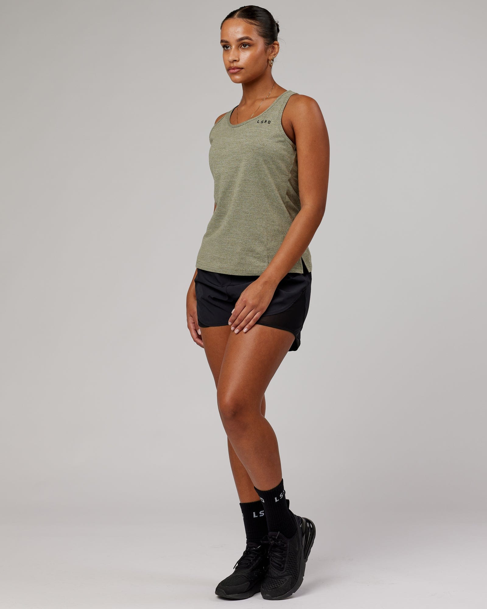 Model wearing Perform VapourFLX Tank - Olive Marl