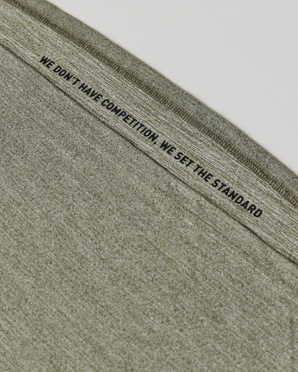 Model wearing Perform VapourFLX Tank - Olive Marl