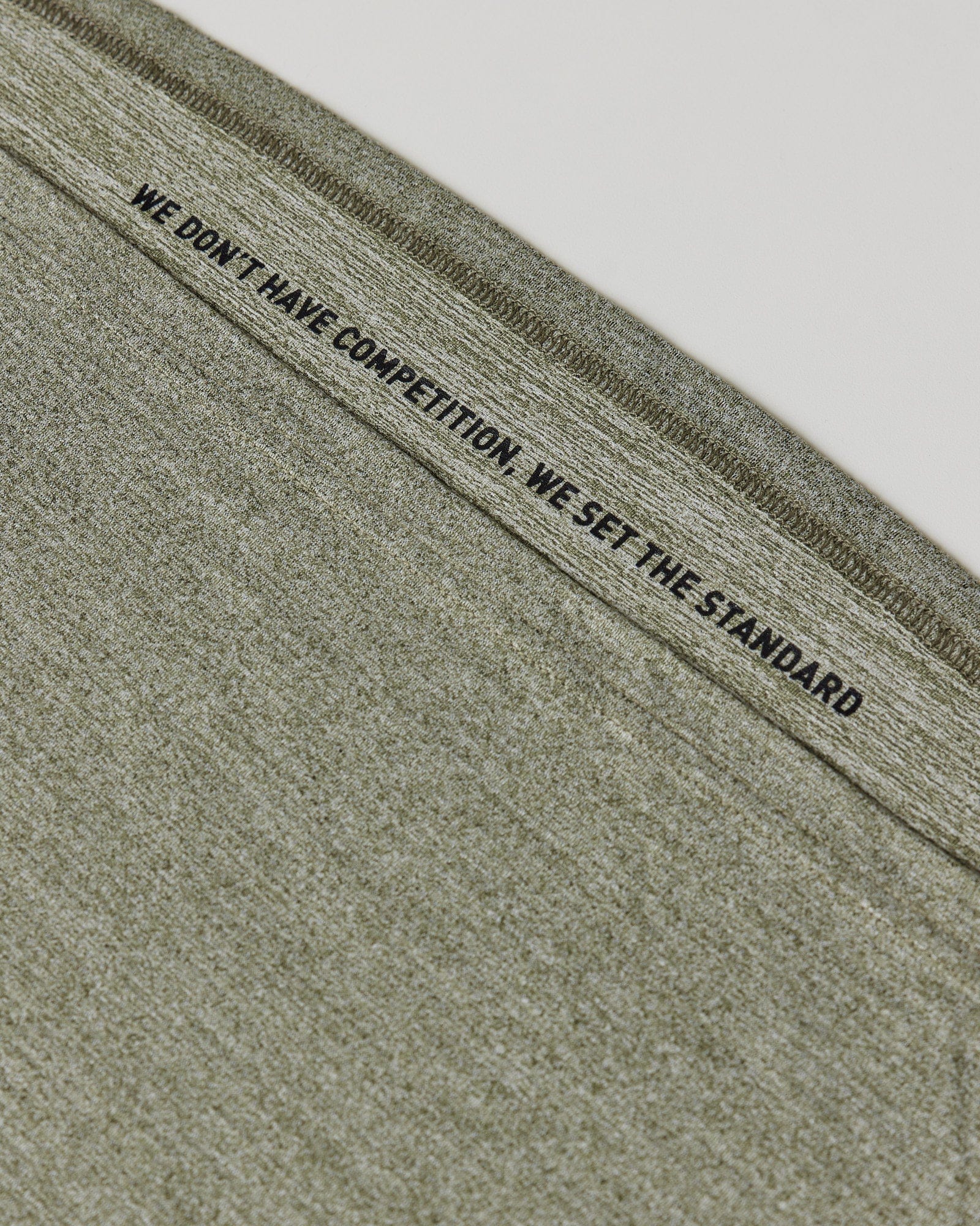 Model wearing Perform VapourFLX Tank - Olive Marl