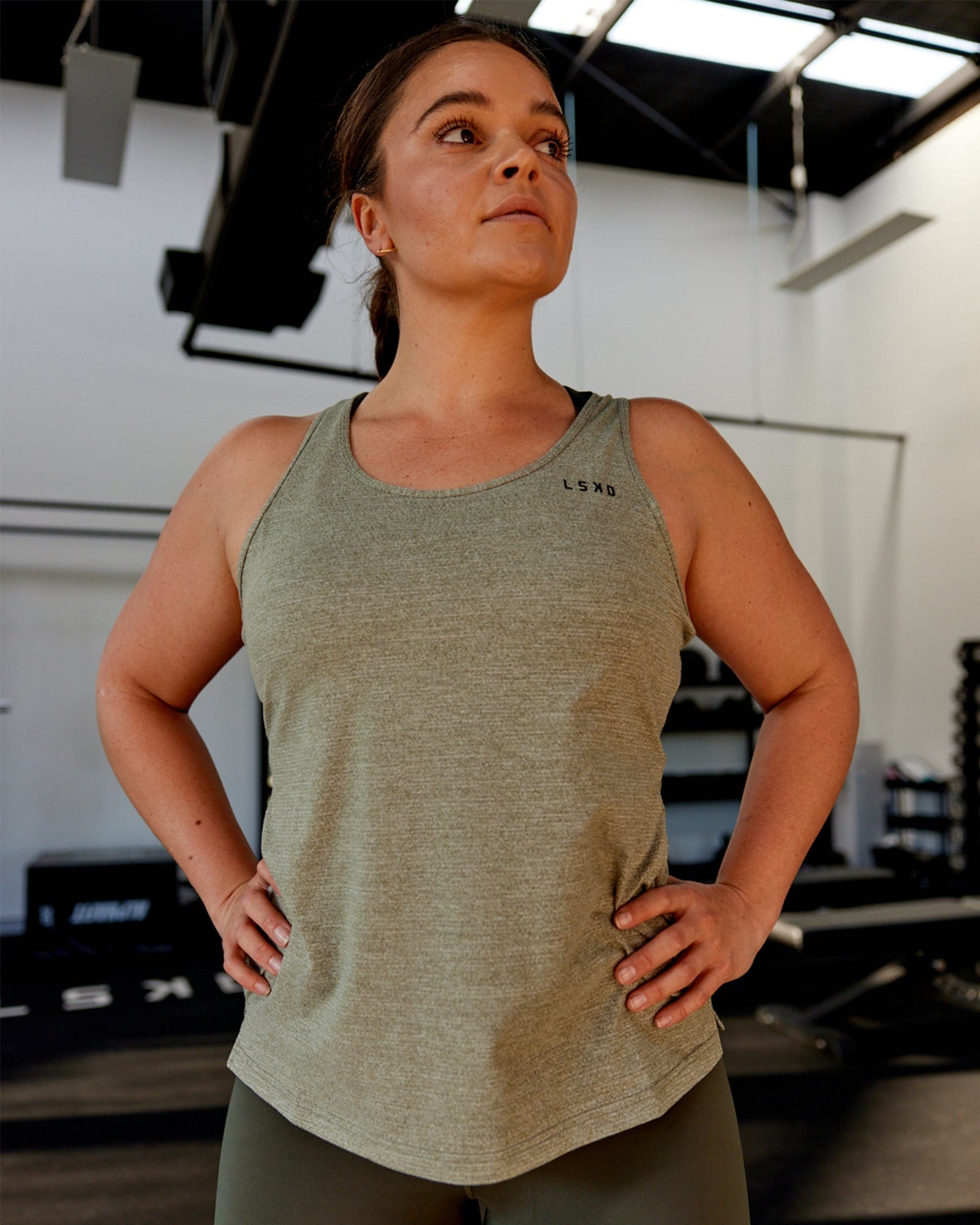 Model wearing Perform VapourFLX Tank - Olive Marl