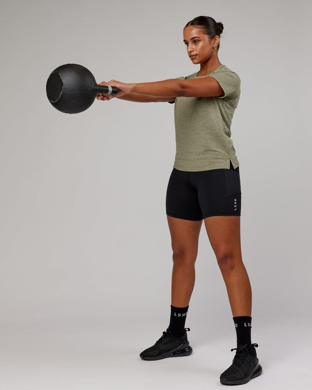 Model wearing Perform VapourFLX Tee - Olive Marl