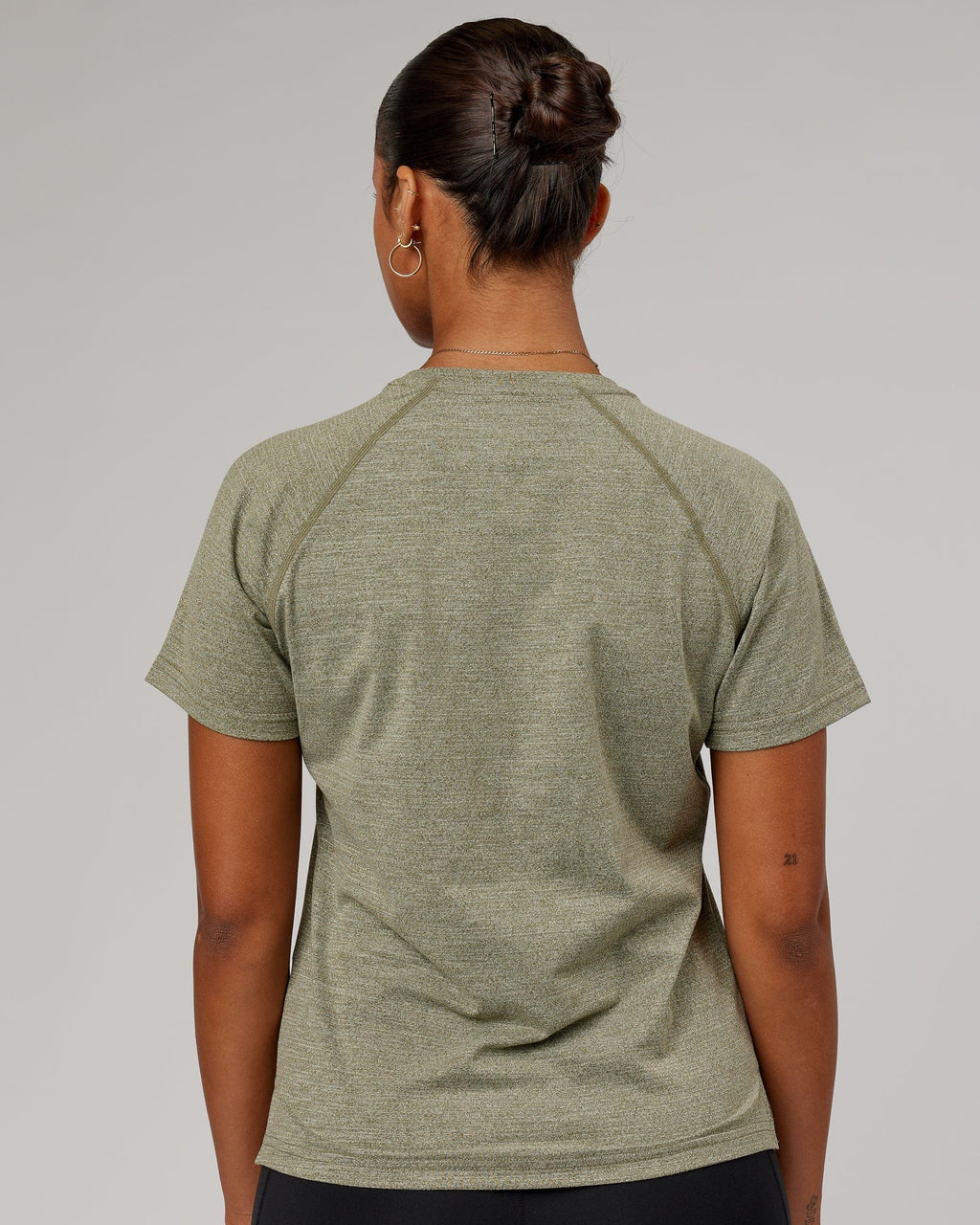 Model wearing Perform VapourFLX Tee - Olive Marl