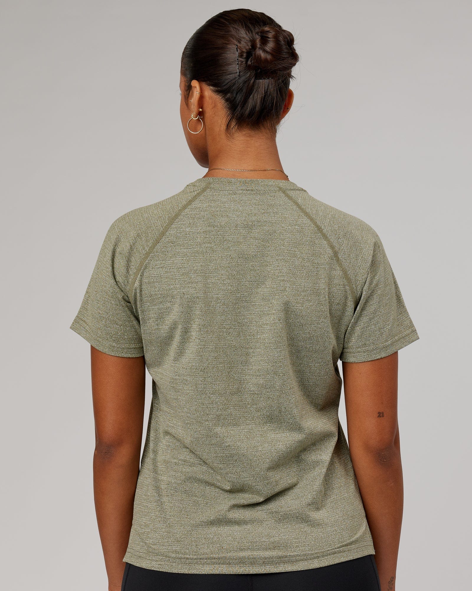 Model wearing Perform VapourFLX Tee - Olive Marl