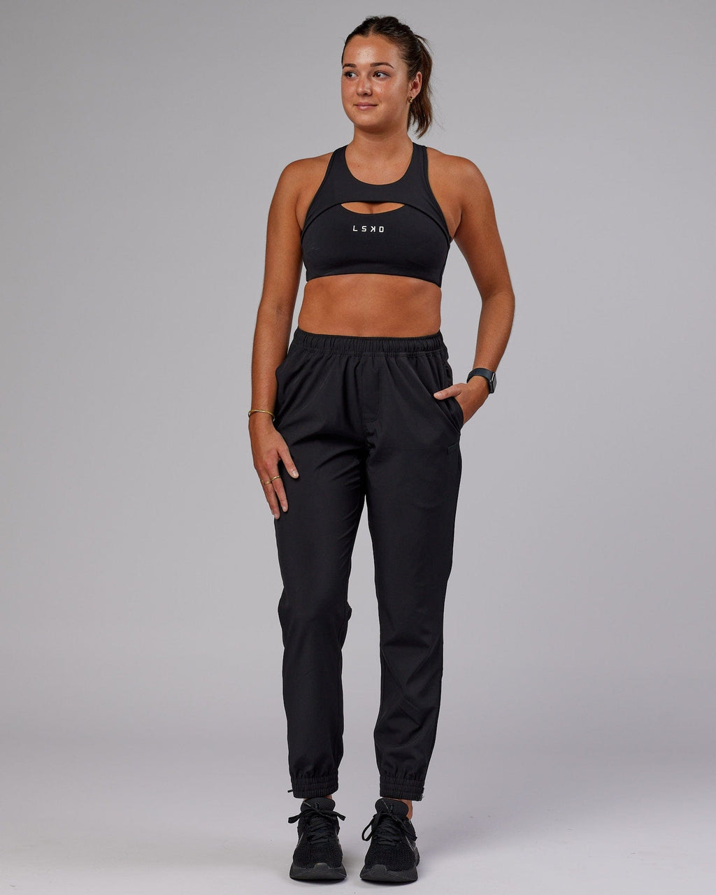 Model wearing Warm Up Zip Cuff Performance Jogger - Black