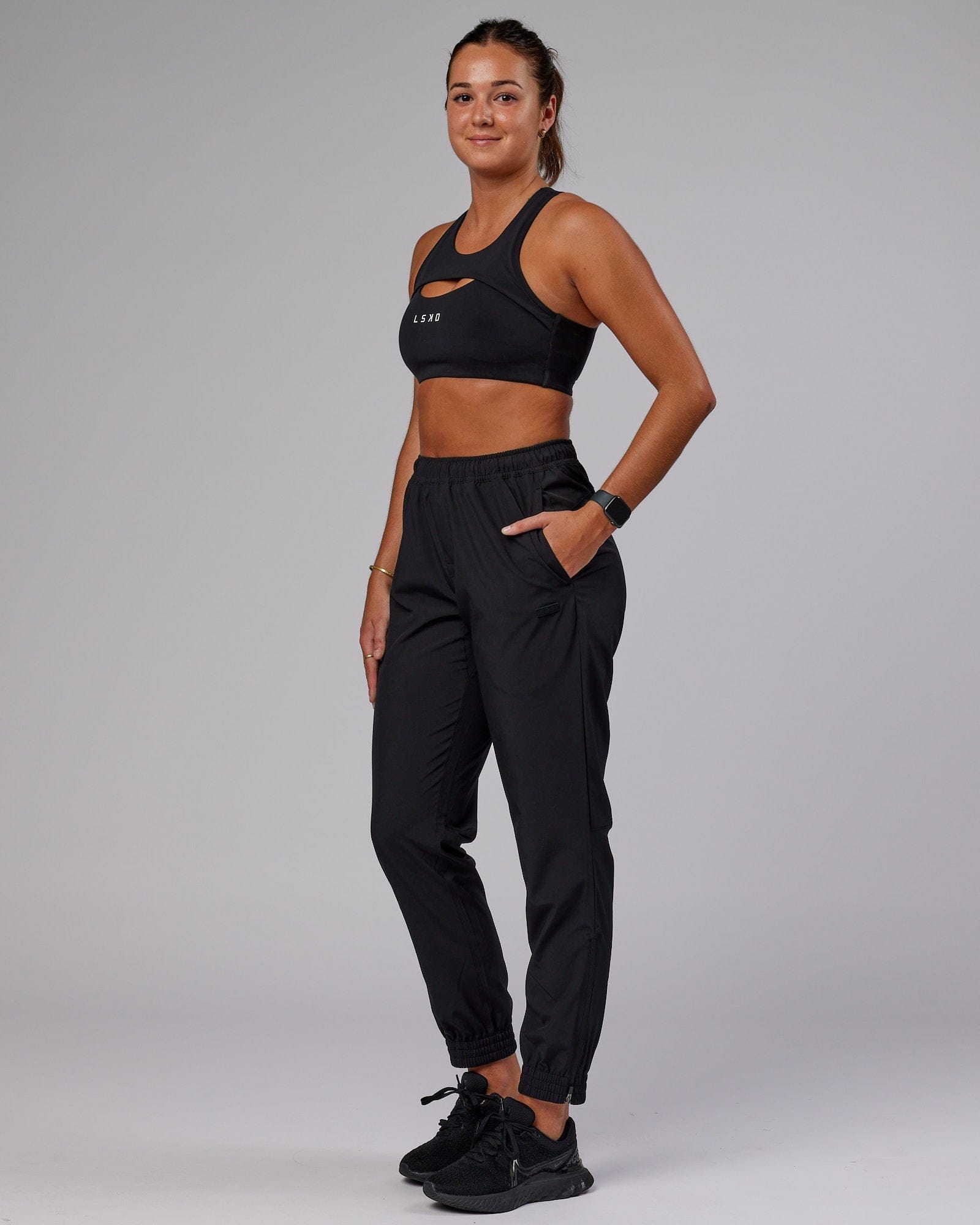 Model wearing Warm Up Zip Cuff Performance Jogger - Black