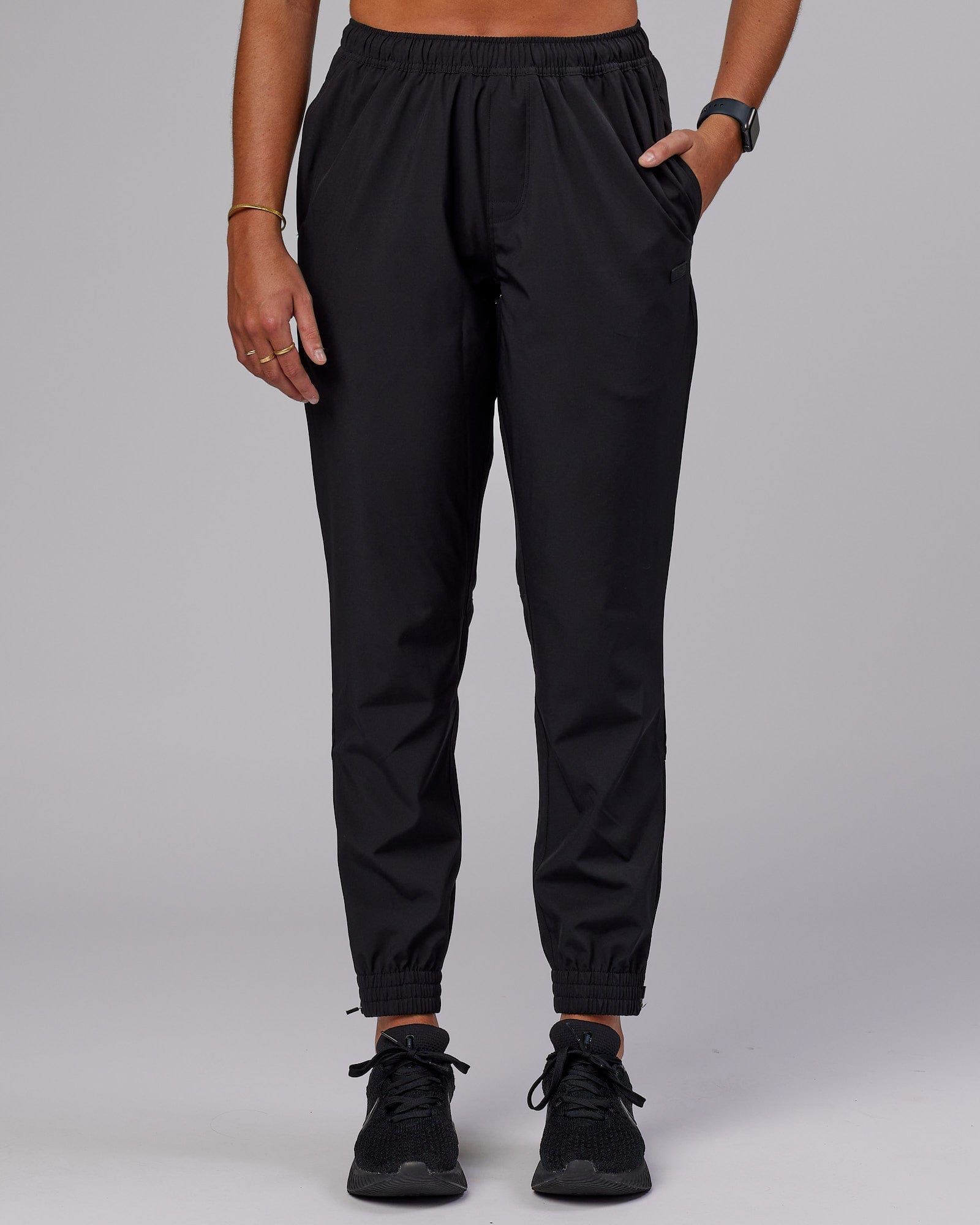 Model wearing Warm Up Zip Cuff Performance Jogger - Black
