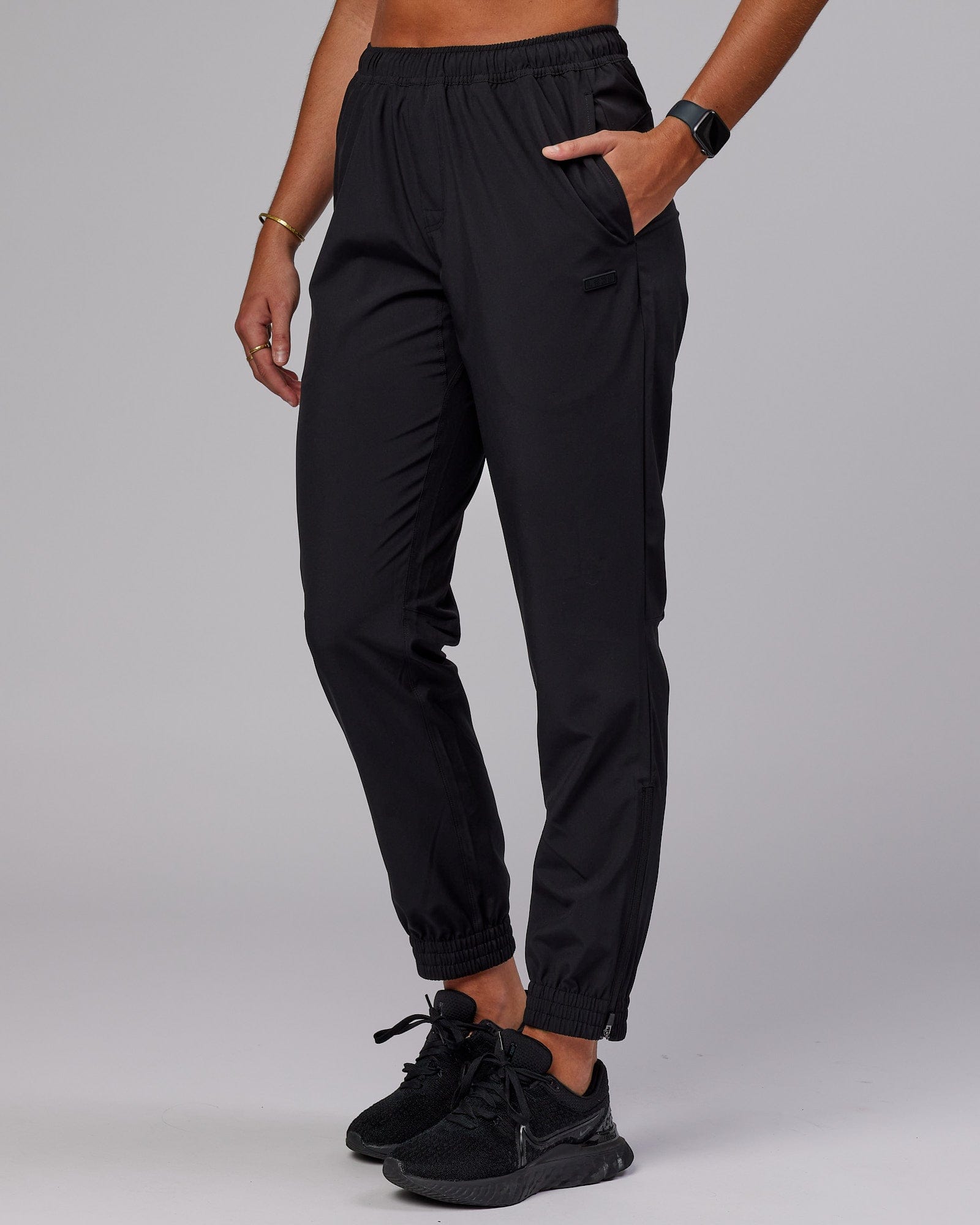 Model wearing Warm Up Zip Cuff Performance Jogger - Black