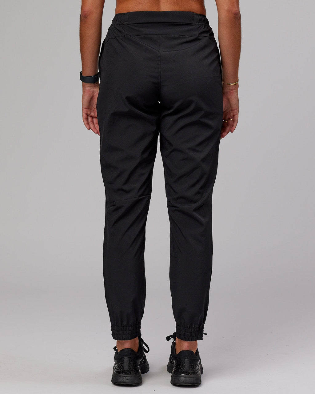 Model wearing Warm Up Zip Cuff Performance Jogger - Black
