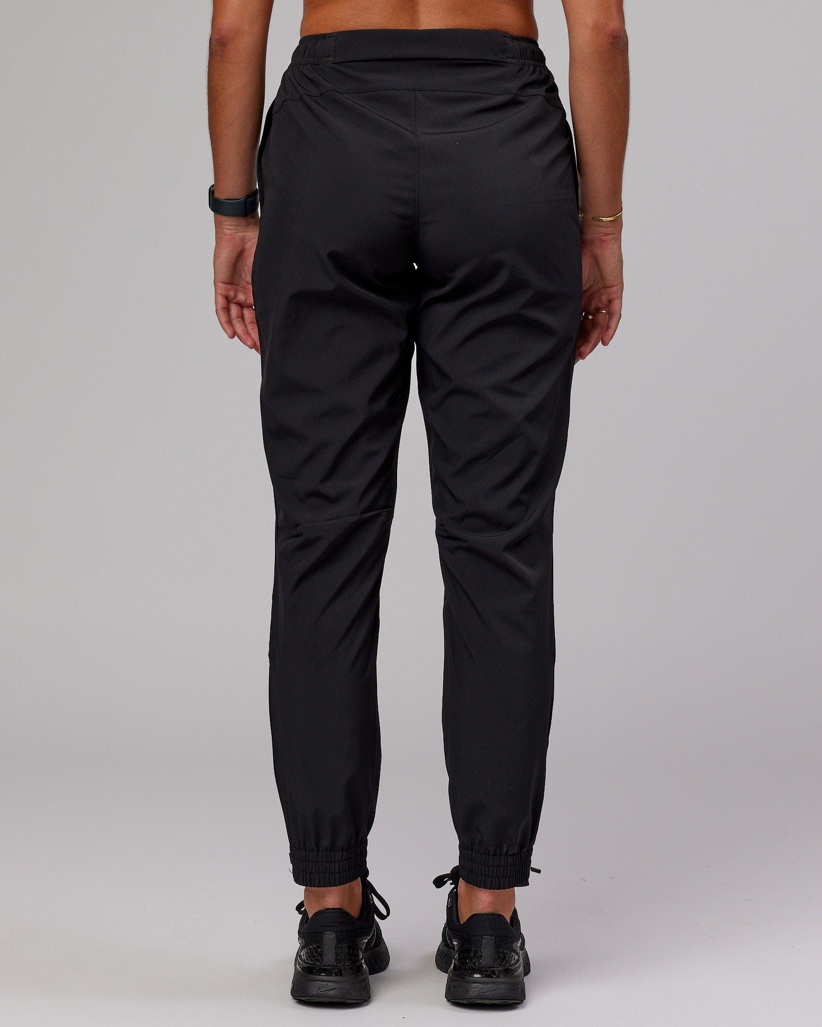 Model wearing Warm Up Zip Cuff Performance Jogger - Black