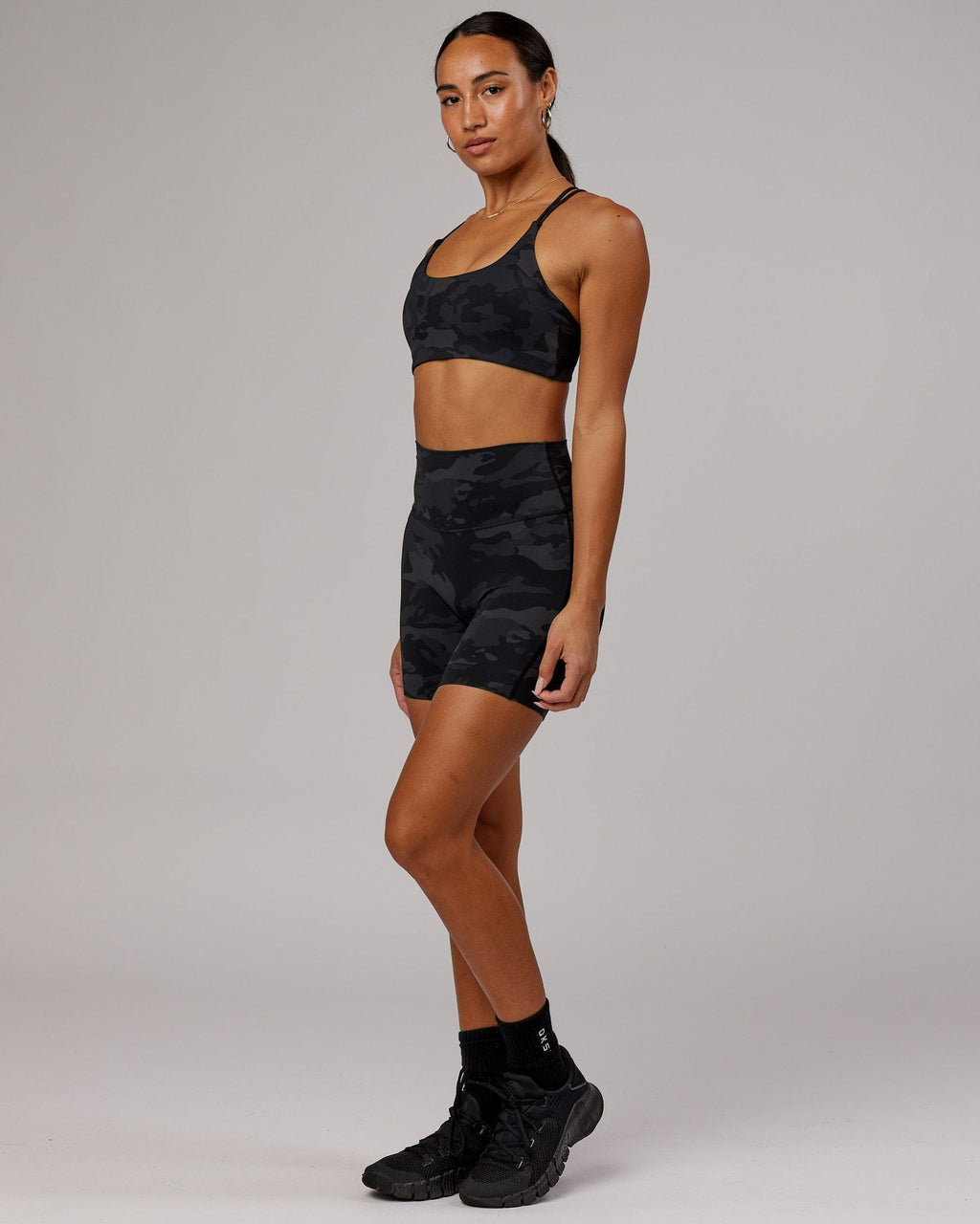 Model wearing Yin Sports Bra - Black Camo